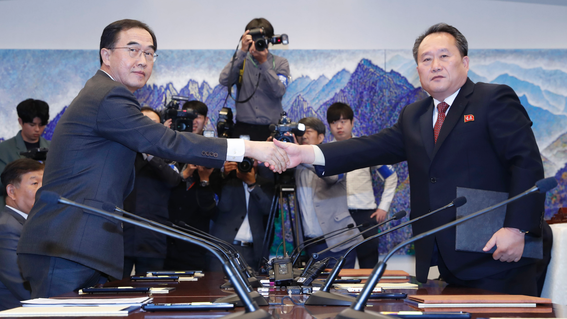 FILE - In this Oct. 15, 2018, file photo, South Korean Unification Minister Cho Myoung-gyon, left, shakes hands with his North Korean counterpart Ri Son Gwon after exchanging the joint statement during their meeting at the southern side of Panmunjom in the Demilitarized Zone, South Korea. South Korea says the United Nations Security Council has granted sanctions exemption for surveys on North Korean railroad sections the Koreas want to connect with the South. (Korea Pool/Yonhap via AP, File)