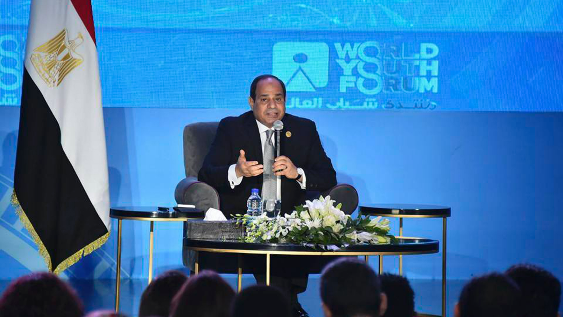 In this photo provided by Egypt's state news agency MENA, Egyptian President Abdel-Fattah el-Sissi, speaks during a youth conference in Sharm El Sheikh, Egypt, Monday, Nov. 5, 2018. Addressing the international youth conference late Sunday el-Sissi said that the 2011 Arab Spring revolt was an ill-advised attempt at change whose chaotic aftermath posed an existential threat to the nation. Egypt's president said those behind the revolt had good intentions but had inadvertently "opened the gates of hell." (MENA via AP)