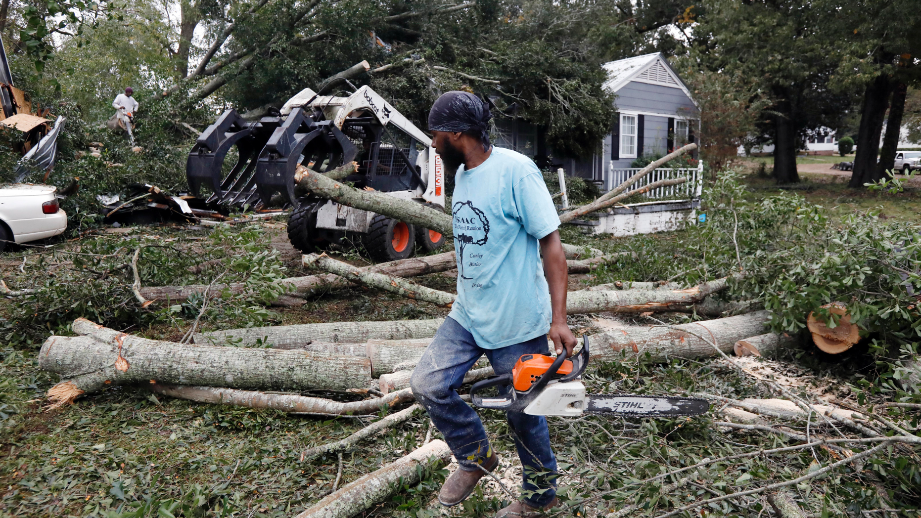 The sound of chainsaws grind through a neighborhood in Natchez, Miss., as cleanup begins following a tornado that hit early Thursday, Nov. 1, 2018. At least 11 tornadoes have been confirmed by National Weather Service surveyors so far in Louisiana and Mississippi as part of a storm system that moved across the region Wednesday night and Thursday. (AP Photo/Rogelio V. Solis)
