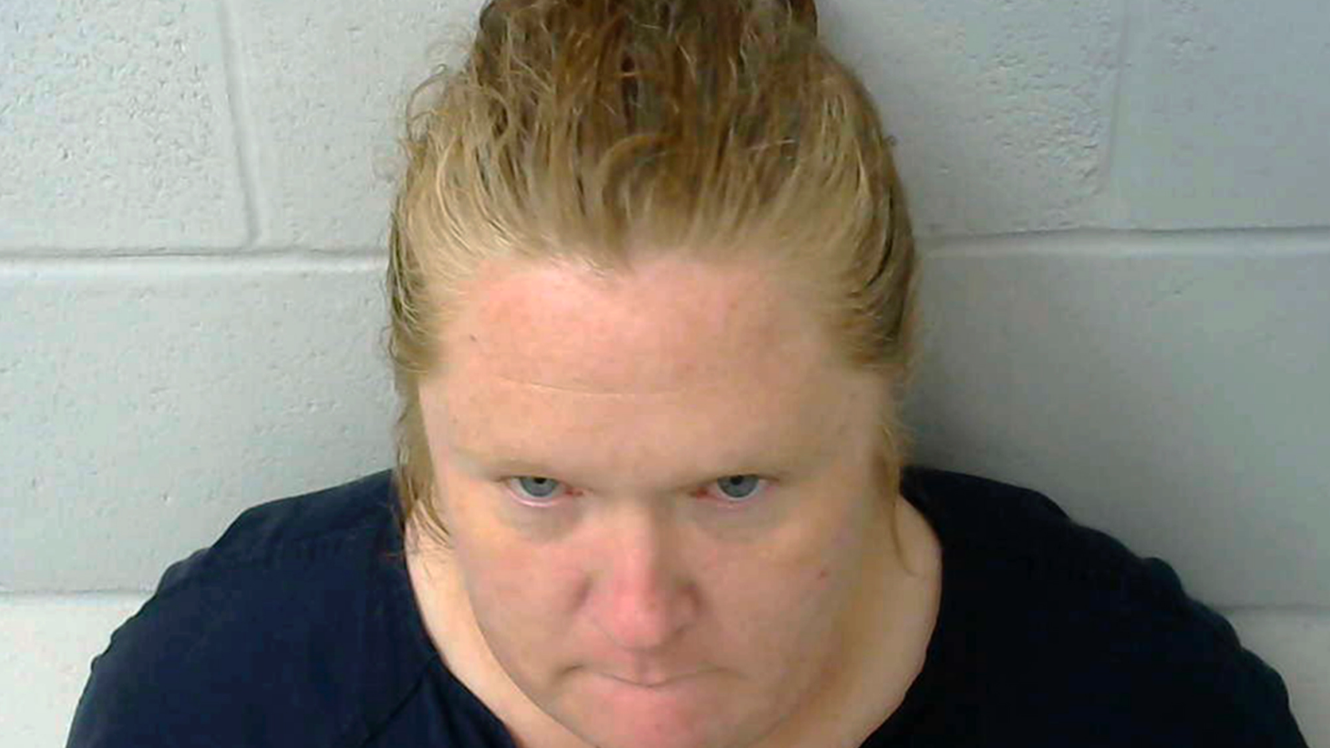 This photo provided by the Okmulgee County Jail in Okmulgee, Okla., shows Amy Leann Hall, who is in custody after three teenagers were shot, one fatally in a shooting reported Thursday morning, Nov. 1, 2018, in the Nuyaka, Okla., area. Authorities believe Hall is the mother of the children. She's currently being held in the Okmulgee County jail on preliminary charges of one count of first-degree murder and two counts of shooting with intent to kill, though formal charges have not yet been filed. (Okmulgee County Jail via AP)