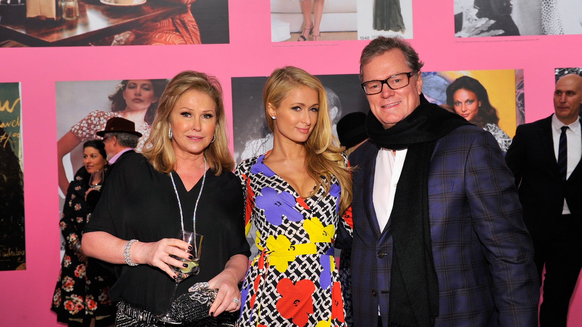 Kathy Hilton, Paris Hilton, wearing Diane Von Furstenberg, and Rick Hilton attend Diane Von Furstenberg's Journey of A Dress Exhibition Opening Celebration at May Company Building at LACMA West.