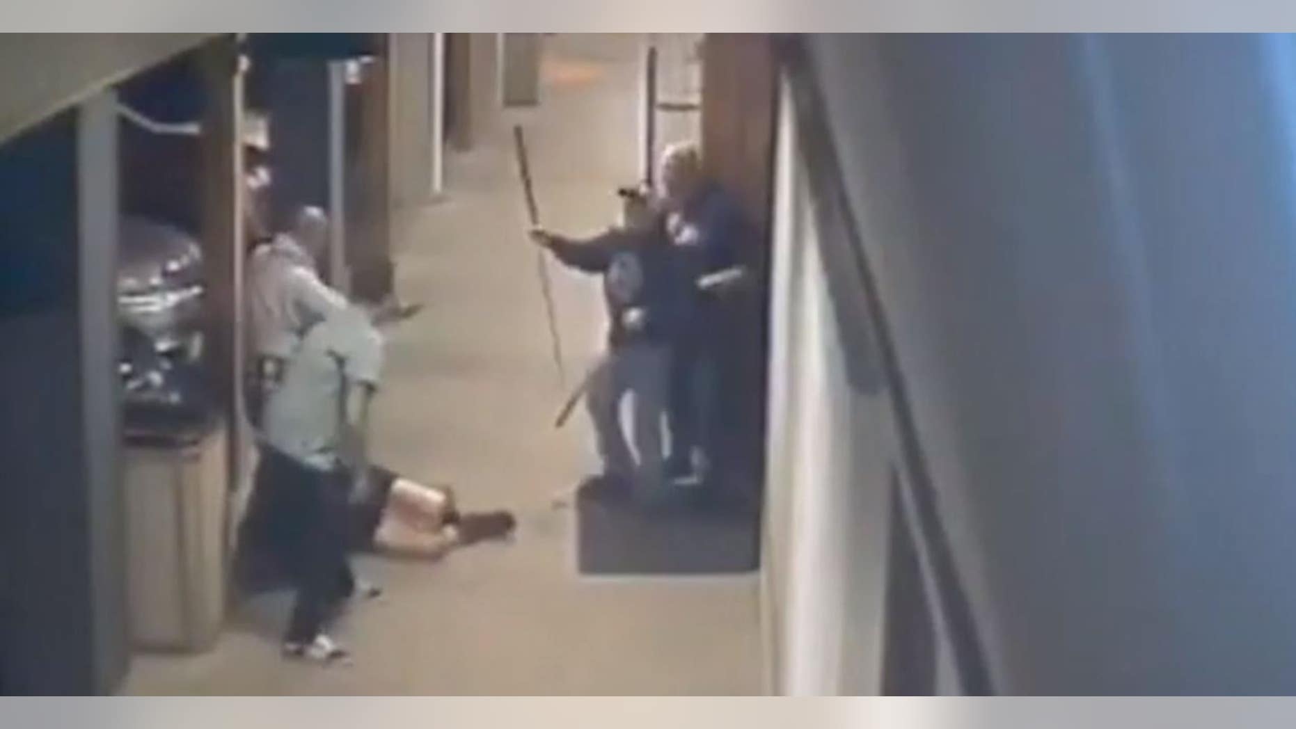 Security camera footage of a Napa, Calif., bar released by police shows two men attacking a woman while other patrons try to intervene.