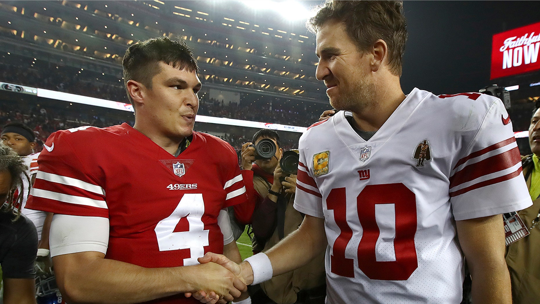 San Francisco 49ers quarterback Nick Mullens (4) shakes hands with New York Giants quarterback Eli Manning (10) after an NFL football game in Santa Clara, Calif., Monday, Nov. 12, 2018.