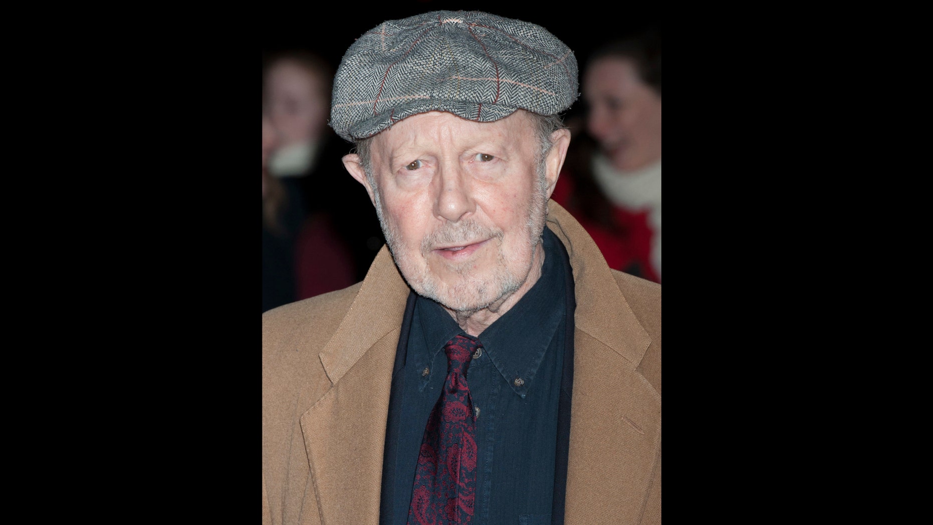 FILE - On this file photo of Thursday, January 19, 2012, Nicolas Roeg arrives for the Film Critics Circle Awards in a central London event. The son of Nicolas Roeg says that the prominent British director has died. He was 90. Nicolas Roeg Jr. told the British press association that the director of