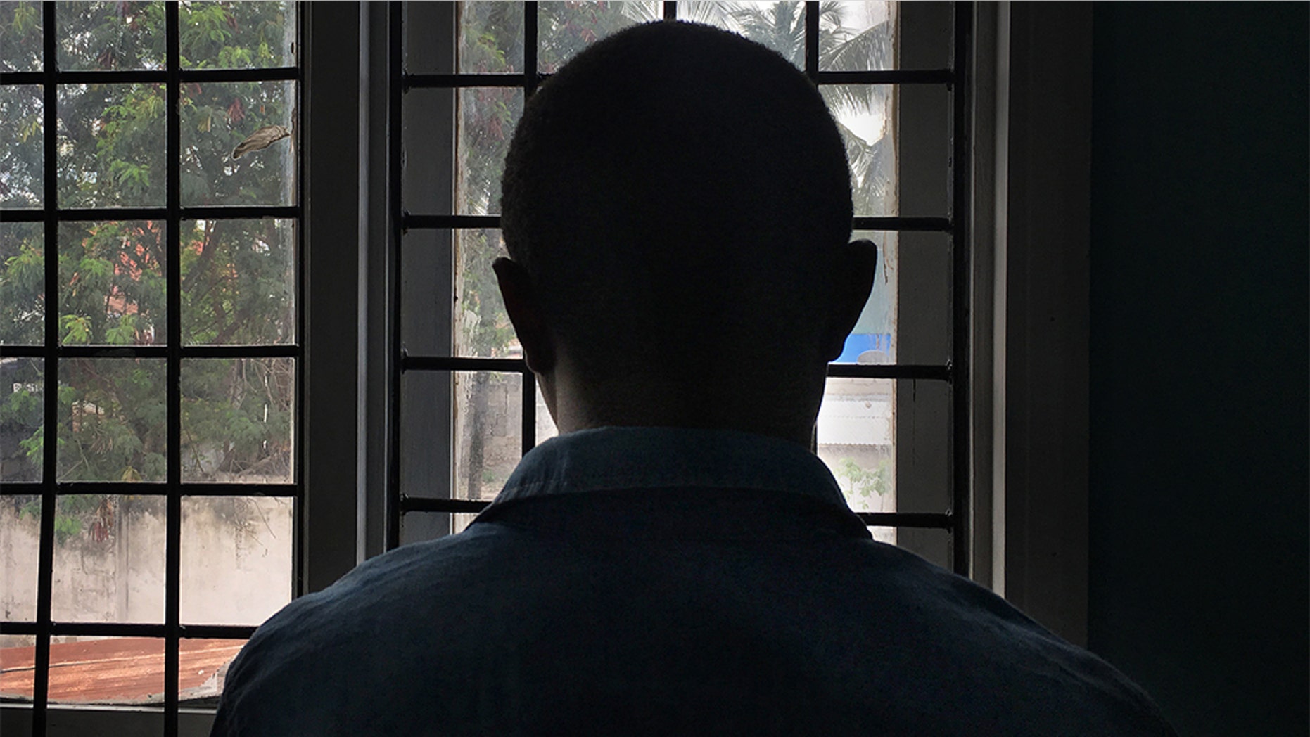 A gay man with HIV stands in a clinic in Dar es Salaam, Tanzania in this 2016 photo.