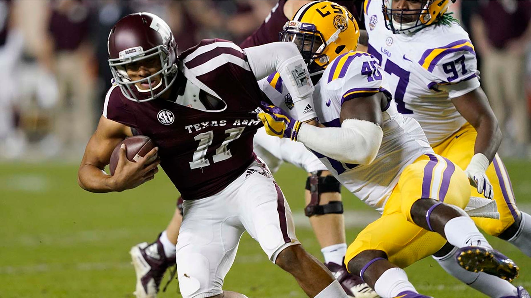 Quarterback Kellen Mond (11) is sacked by LSU linebacker Devin White (40) during the first half of an NCAA college football game Saturday, Nov. 24, 2018, in College Station, Texas. (AP Photo/David J. Phillip)
