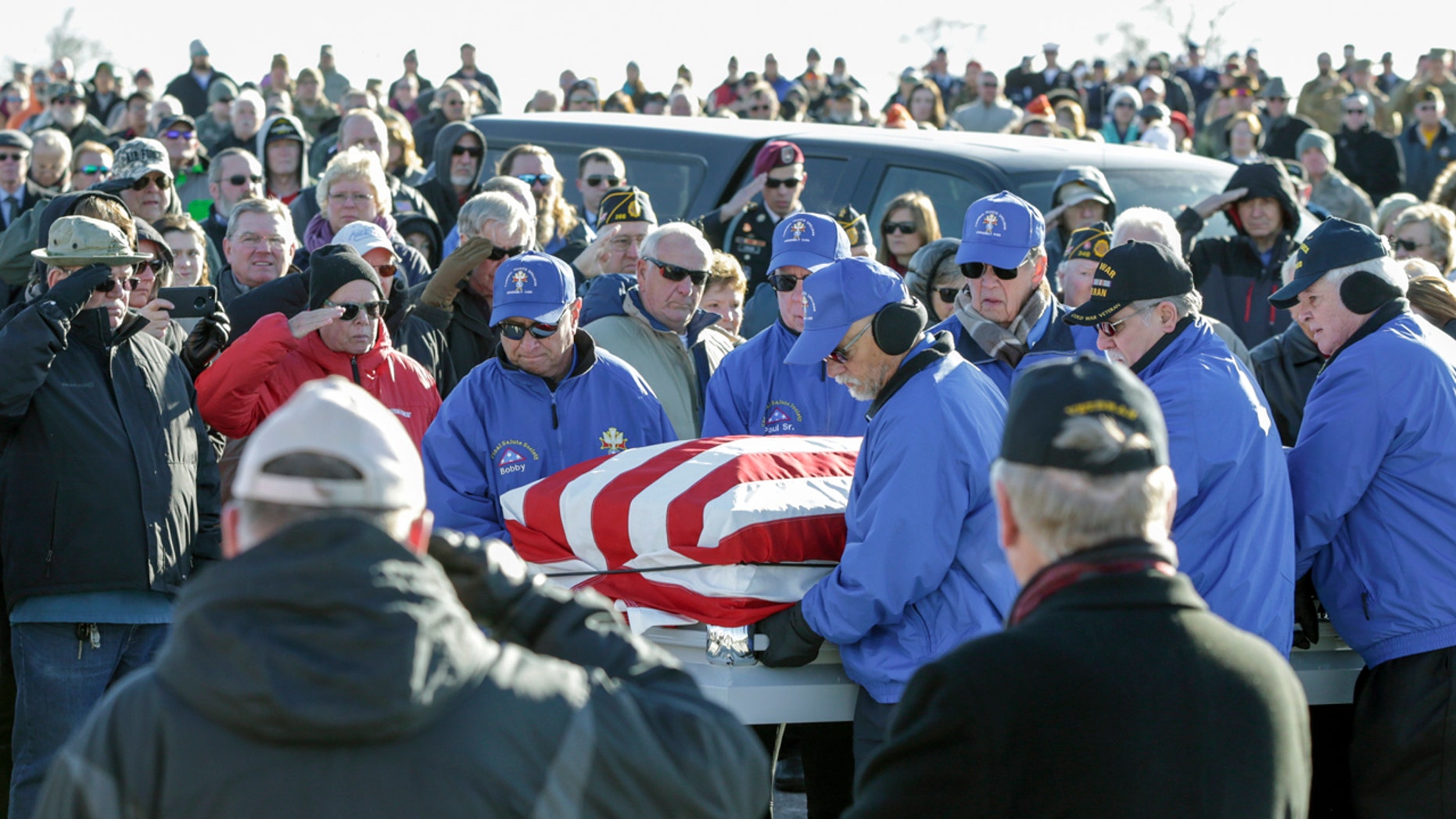 Pallbearers carrying the flag-draped casket of Vietnam veteran Stanley Stoltz at the Omaha National Cemetery on Tuesday. (AP Photo/Nati Harnik)