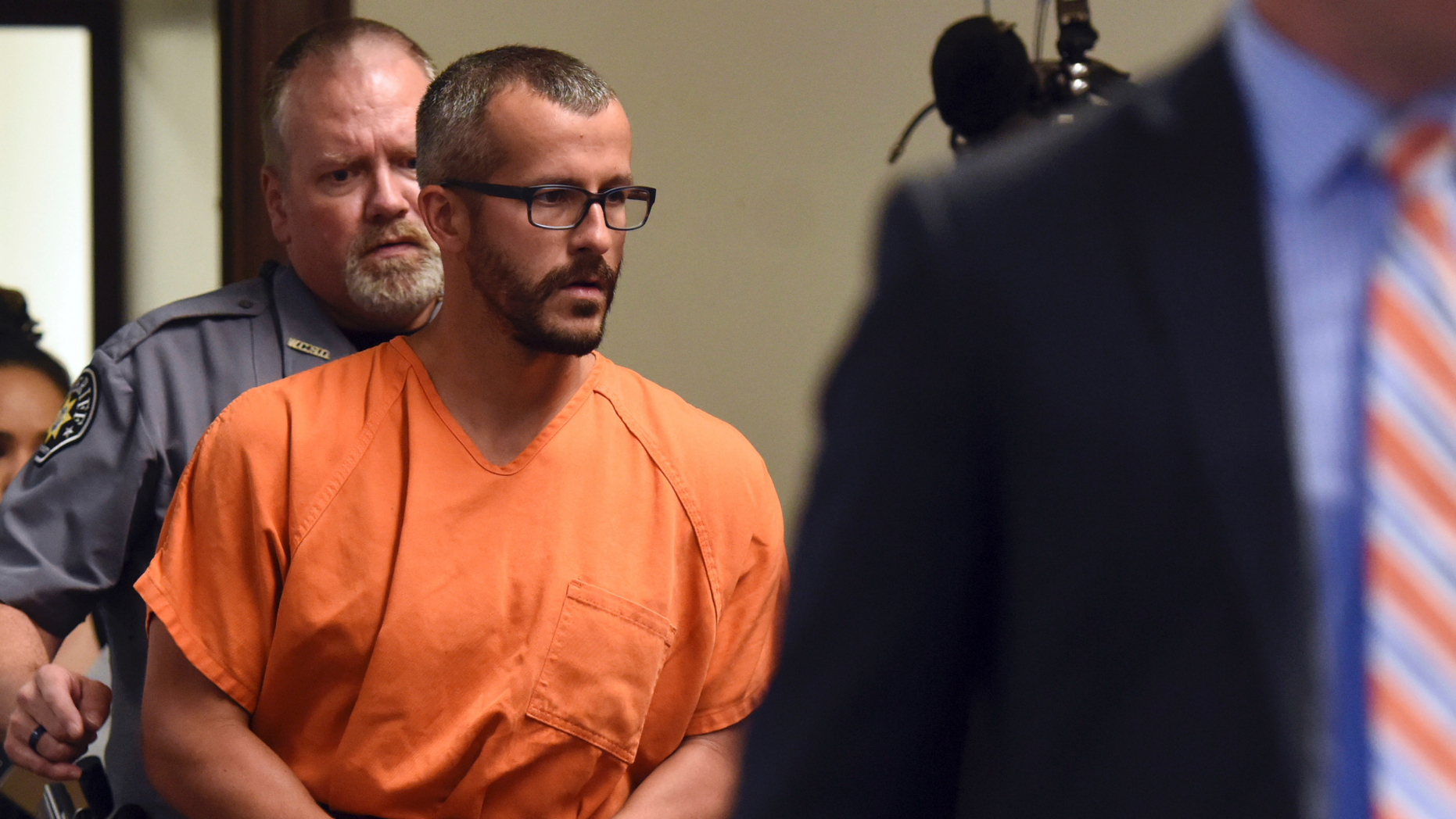 Christopher Watts is escorted into the courtroom before his bond hearing at the Weld County Courthouse in Greeley Colo. The Colorado man charged with killing his pregnant wife and two daughters has pleaded guil