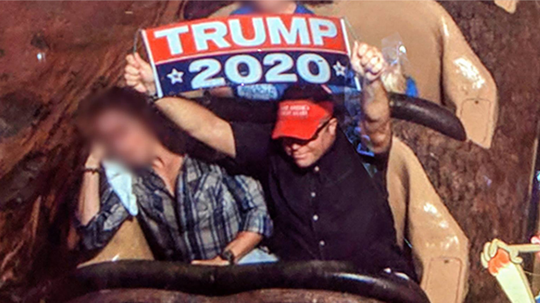 A man has been banned from Disney World for the second time after violating the rule that prohibits guest from displaying signs or banners at the park.