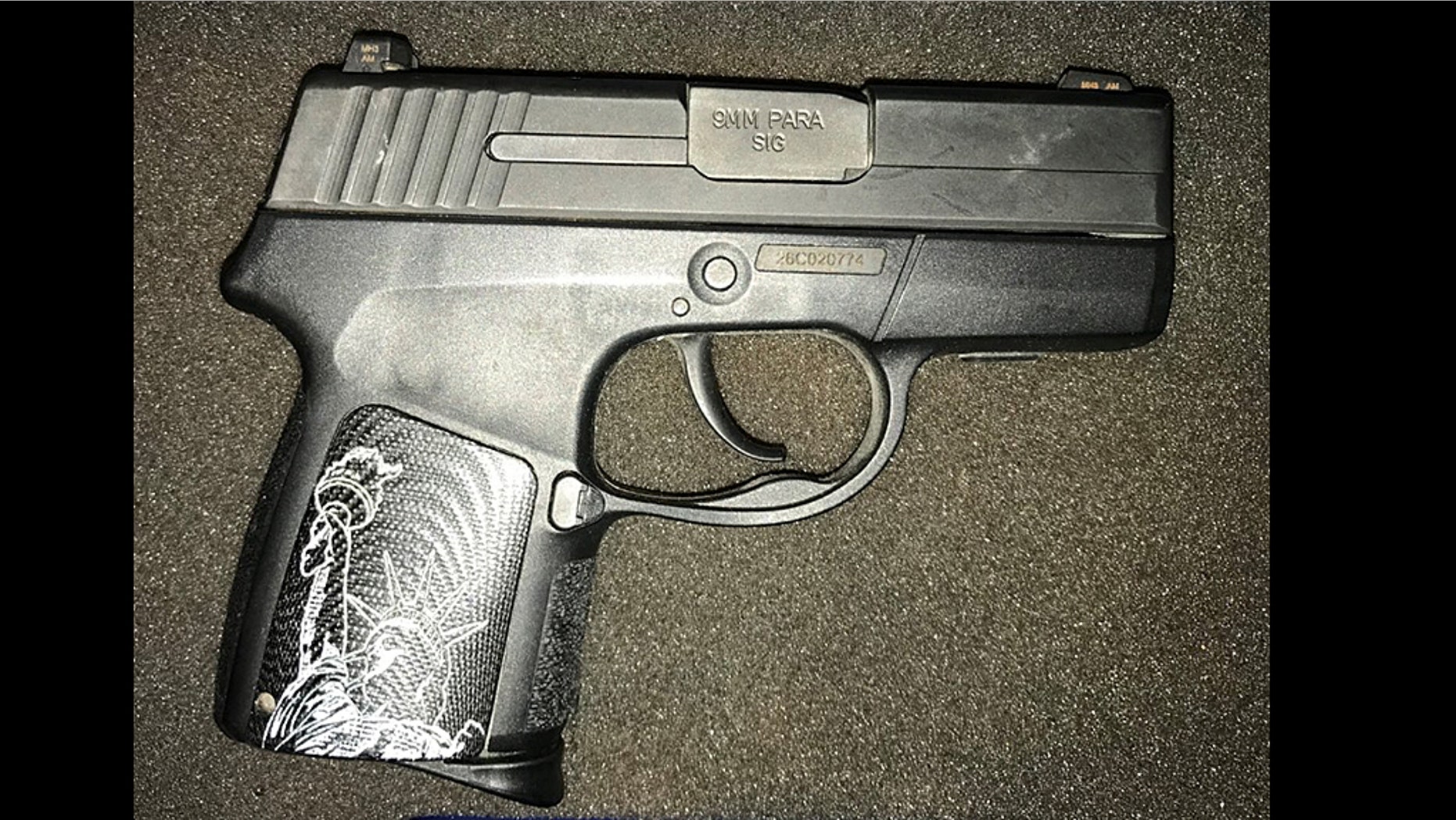A woman was caught trying to carry a 9mm handgun with the Statue of Liberty on it through security at an airport in Virginia.