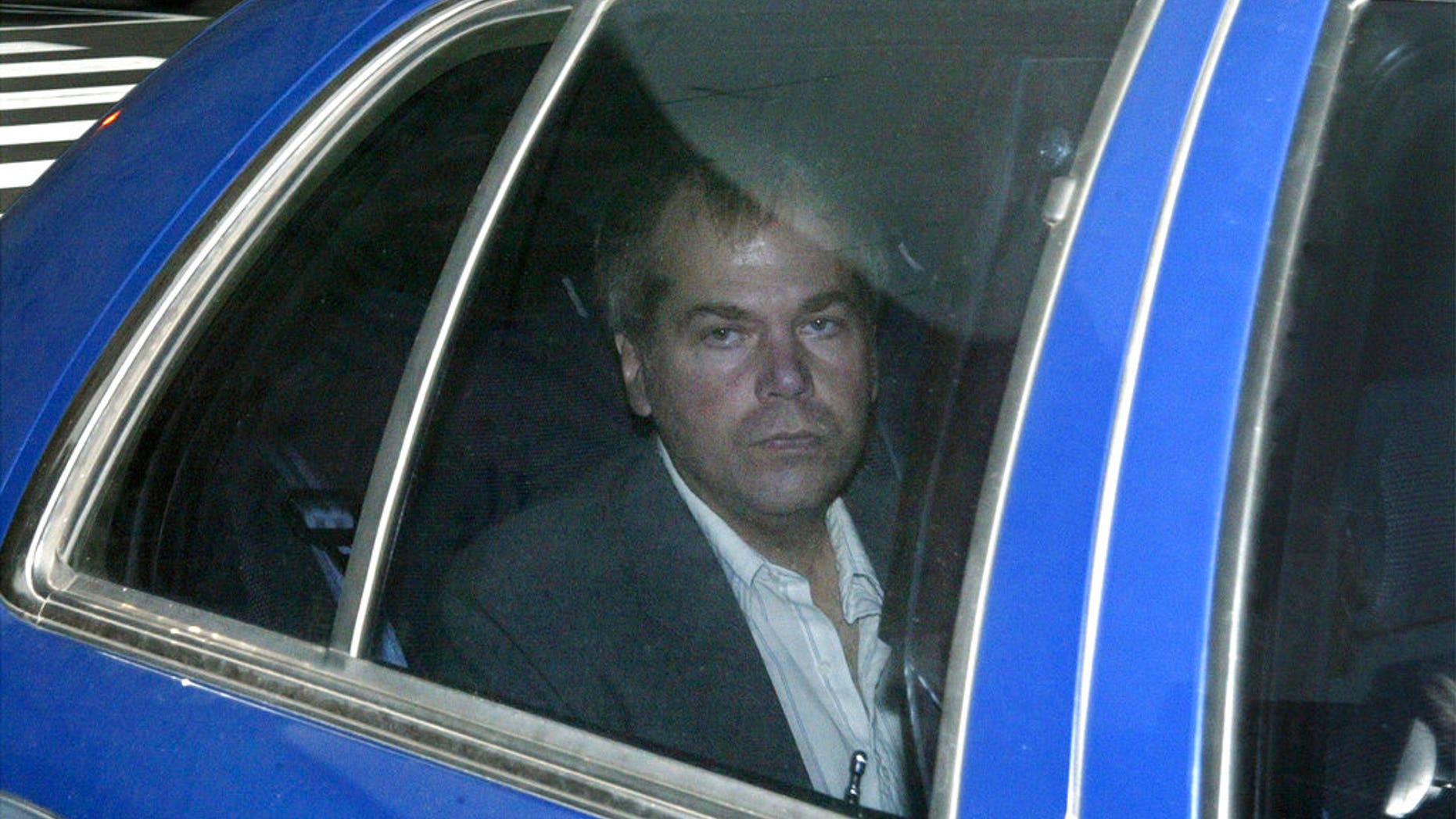 FILE - In this Nov. 18, 2003 file photo, John Hinckley Jr. arrives at U.S. District Court in Washington. A judge has ruled that the man who tried to assassinate President Ronald Reagan can move out of his mother’s house. U.S. District Court Judge Paul L. Friedman ordered Friday, Nov. 16, 2018, that Hinckley can live by himself or with others within 75 miles of Williamsburg, Va. Hinckley left a mental hospital to live with his mother in Williamsburg in 2016. (AP Photo/Evan Vucci, File)
