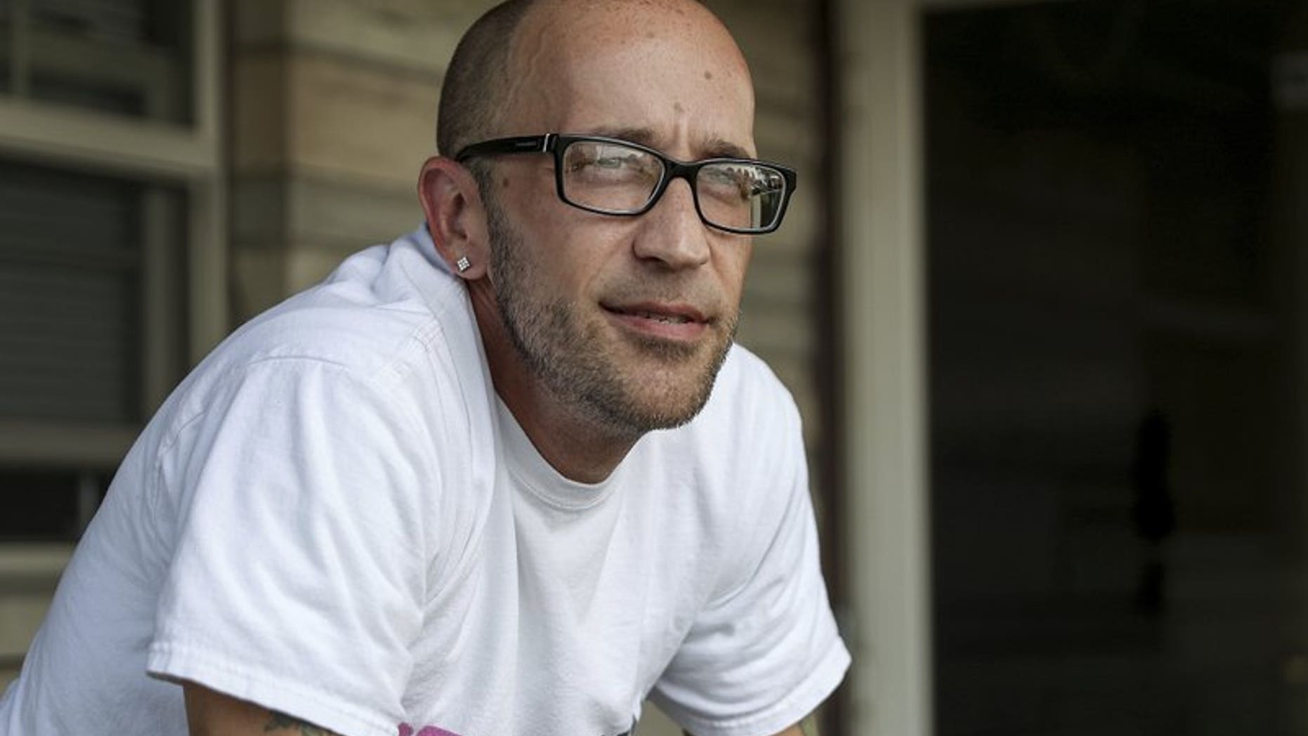 In this Aug. 13, 2018, file photo, Tyson Timbs poses for a portrait at his aunt's home in Marion, Ind. Five years ago, Timbs had his $42,000 Land Rover taken by the government in a process known as "civil asset forfeiture," after he pled guilty to selling $260 of heroin.
