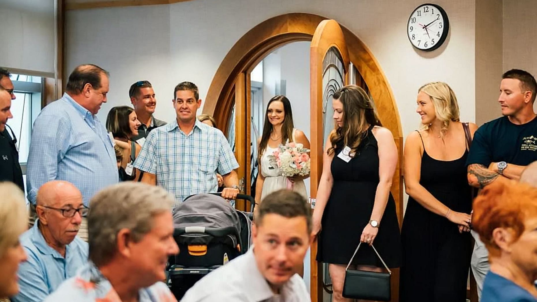 Sabrina and Justin Ernst walked down the aisle with their son at the hospital’s chapel after the 6-month-old suffered a brain injury.