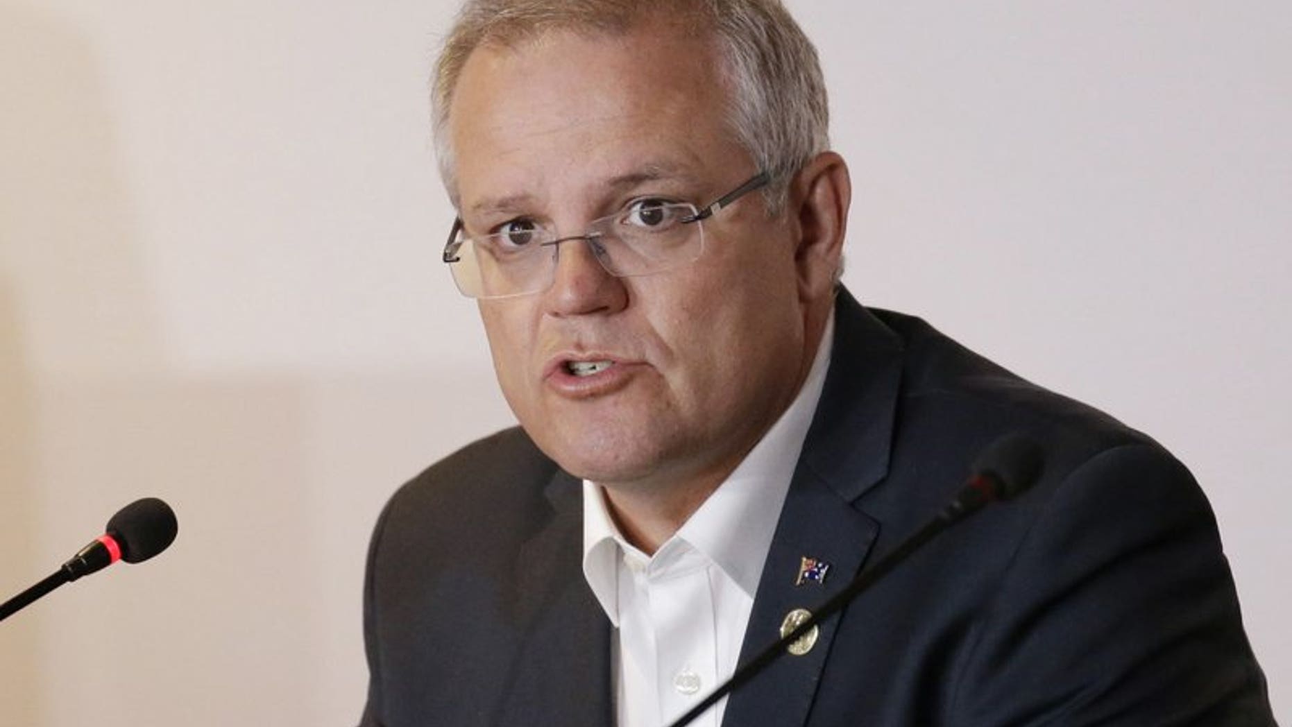In this Nov. 18, 2018, file photo, Australian Prime Minister Scott Morrison speaks during the APEC 2018 meetings in Port Moresby, Papua New Guinea. Australia has decided to formally recognize west Jerusalem as Israel’s capital, but won’t move its embassy until there’s a peace settlement between Israel and Palestinians, Prime Minister Morrison announced Saturday.