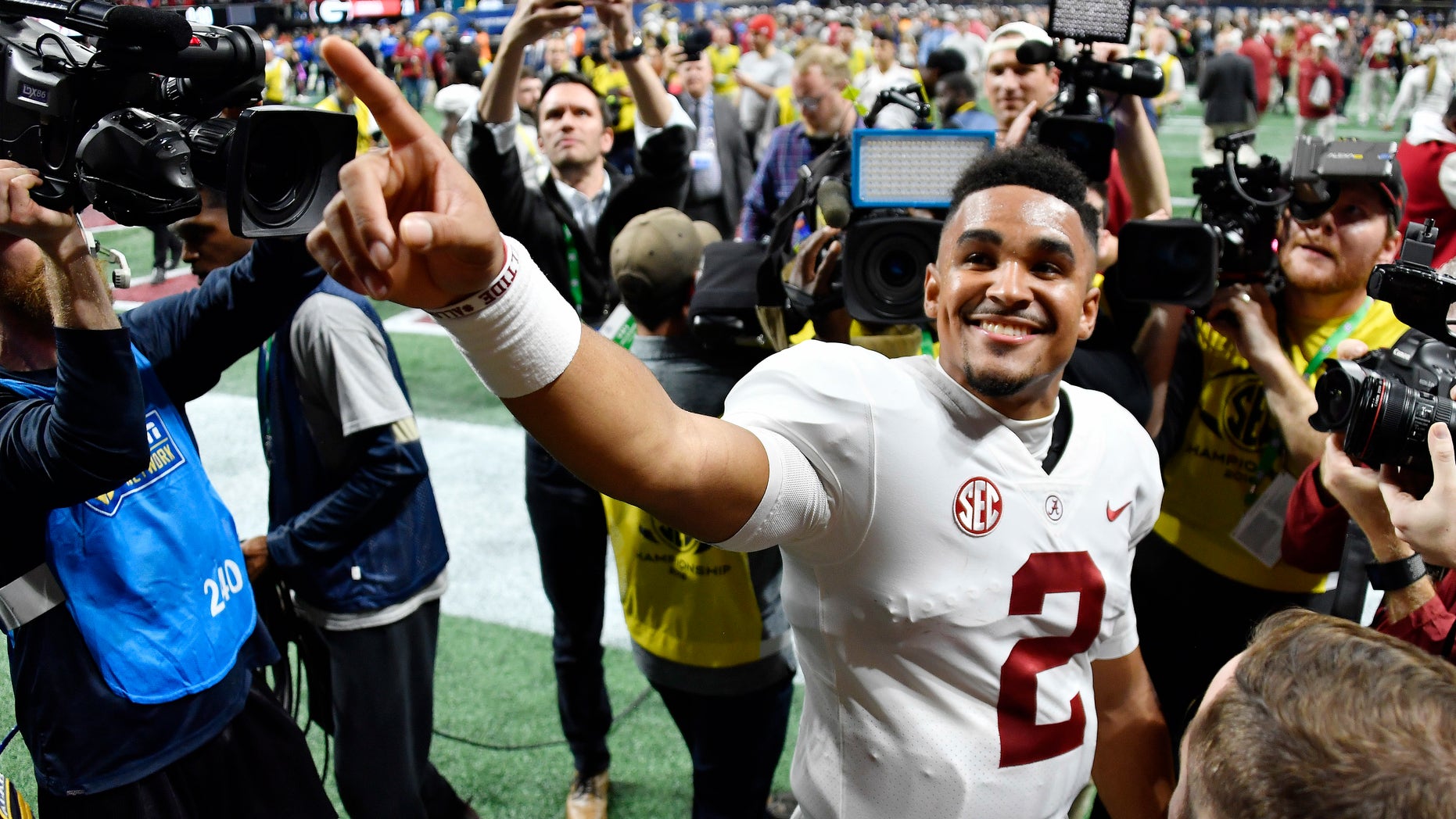 Alabama quarterback Jalen Hurts (2) speaks to fans after the Southeastern Conference championship NCAA college football game between Georgia and Alabama, Saturday, Dec. 1, 2018, in Atlanta. Alabama won 35-28.
