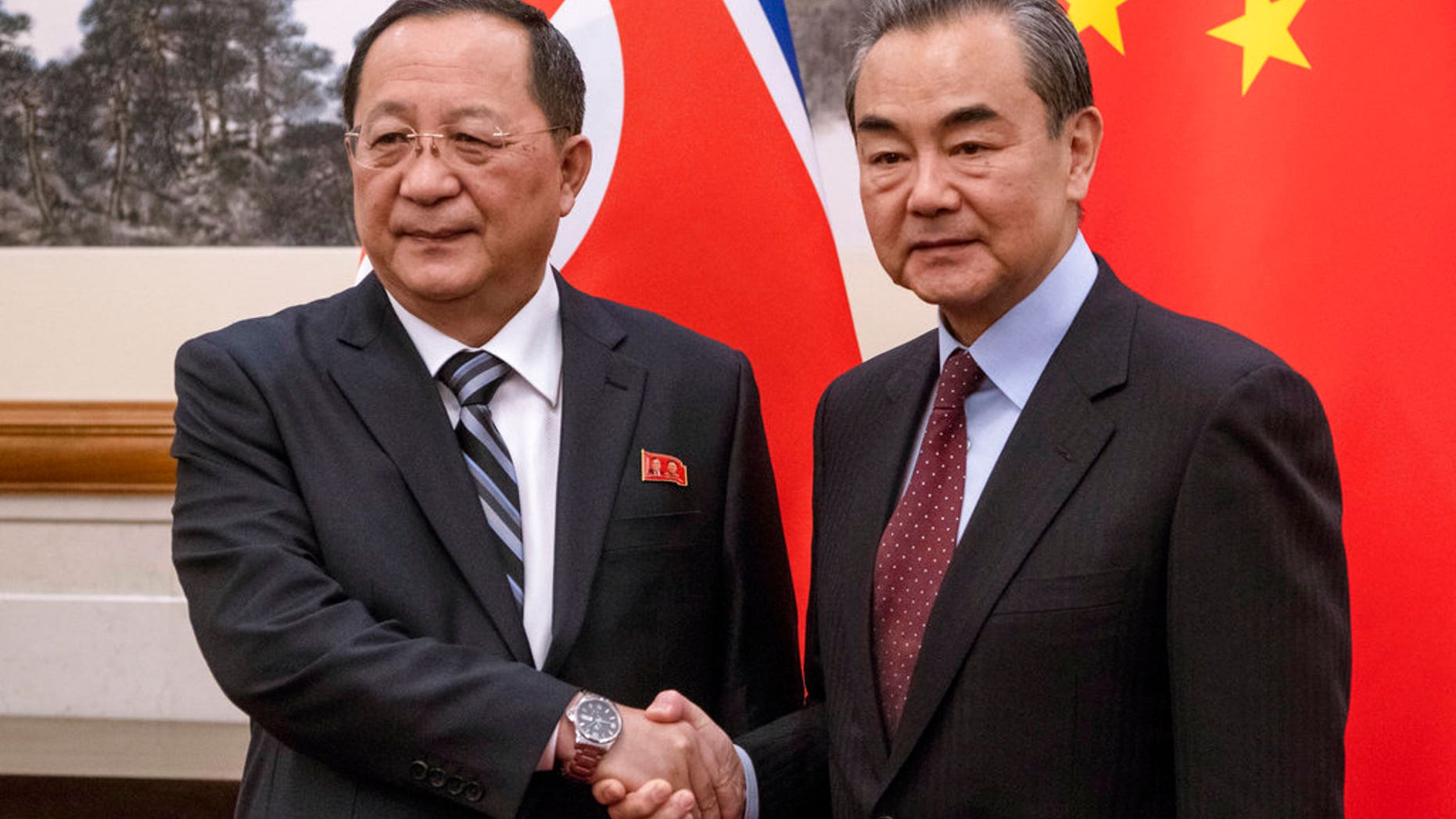 North Korean Foreign Minister Ri Yong Ho, left meets China's Foreign Minister Wang Yi at the Diaoyutai State Guesthouse in Beijing.
