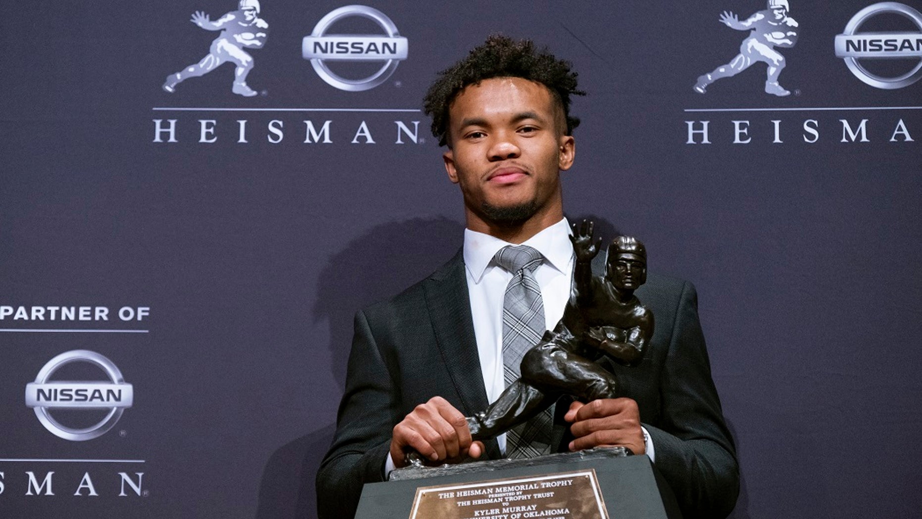 Oklahoma quarterback Kyler Murray holds the Heisman Trophy after winning the award Saturday, Dec. 8, 2018, in New York. (Associated Press)