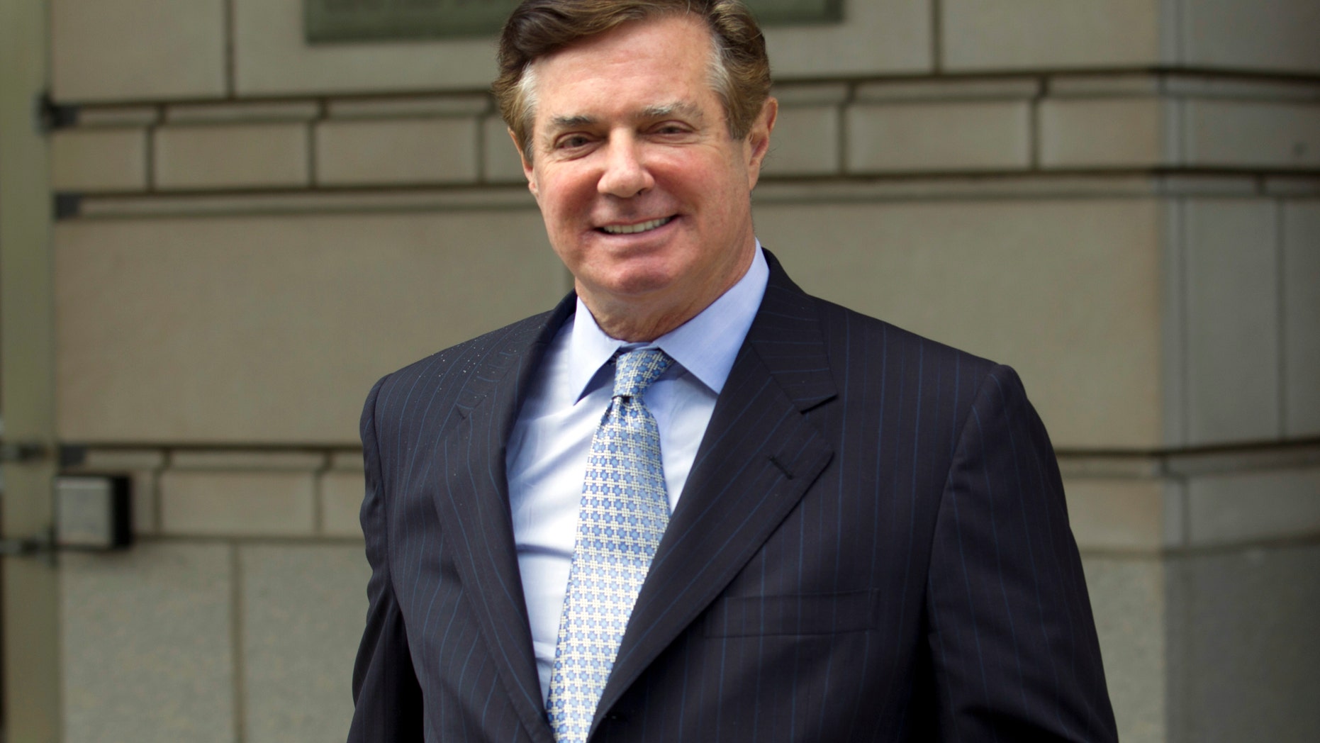 FILE - In this May 23, 2018 file photo, Paul Manafort, President Donald Trump's former campaign chairman, leaves the Federal District Court after a hearing in Washington. ( AP Photo/Jose Luis Magana)