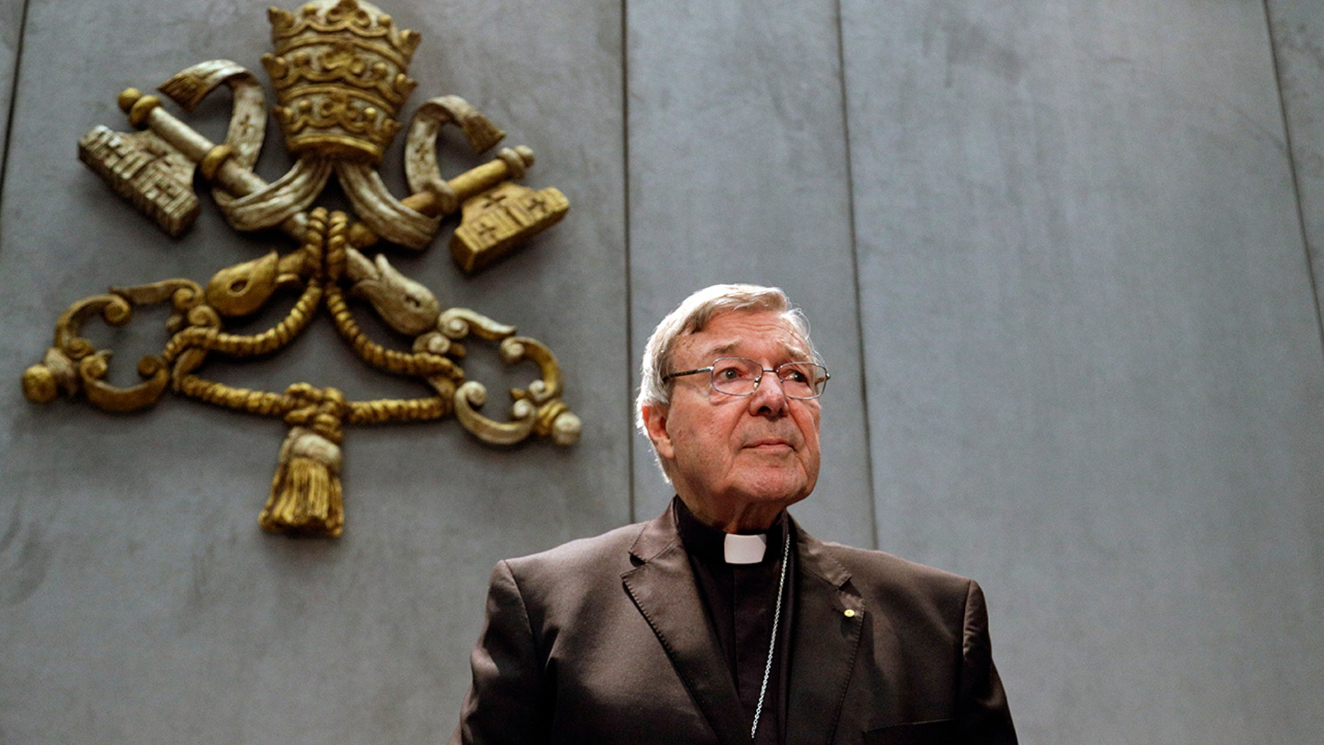 Cardinal George Pell was reportedly convicted in his native Australia of charges related to sexual abuse. The Vatican on Wednesday said he was removed from Pope Francis' informal cabinet. (AP Photo/Gregorio Borgia, File)