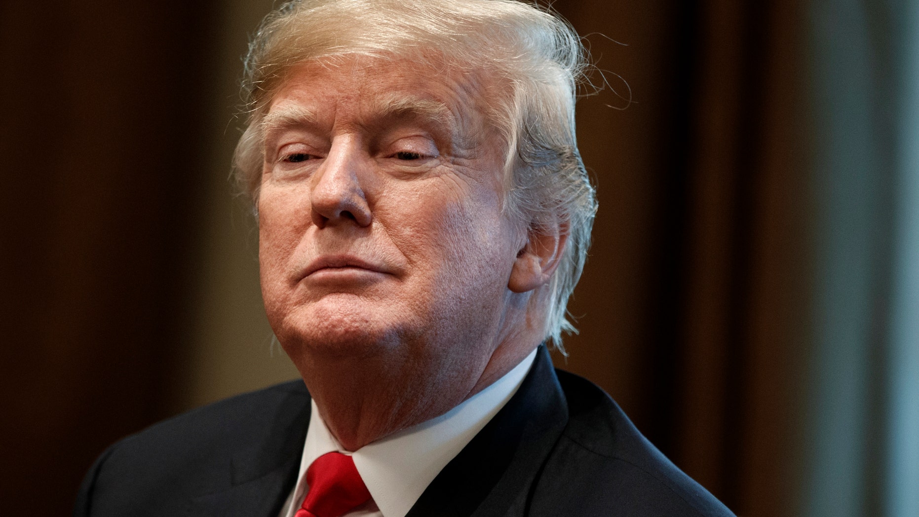 FILE -- President Donald Trump listens during a meeting in the Cabinet Room of the White House in Washington. (AP Photo/Evan Vucci, File)