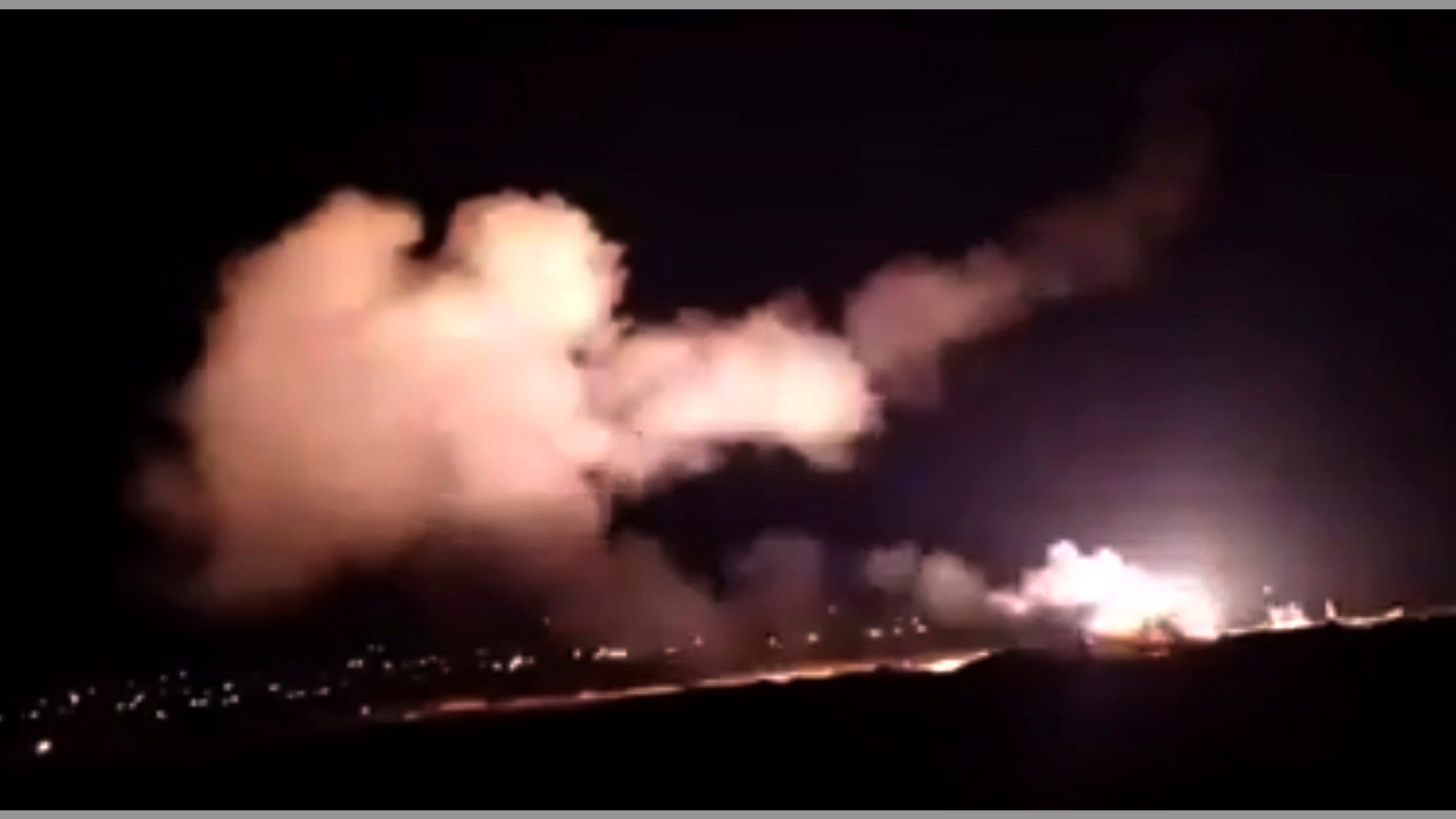 This frame grab from a video provided by the Syrian official news agency SANA shows missiles flying into the sky near Damascus, Syria, Tuesday, Dec. 25, 2018. Israeli warplanes flying over Lebanon fired missiles toward areas near the Syrian capital of Damascus late Tuesday, hitting an arms depot and wounding three soldiers, Syrian state media reported, saying that most of the missiles were shot down by air defense units. (SANA via AP)