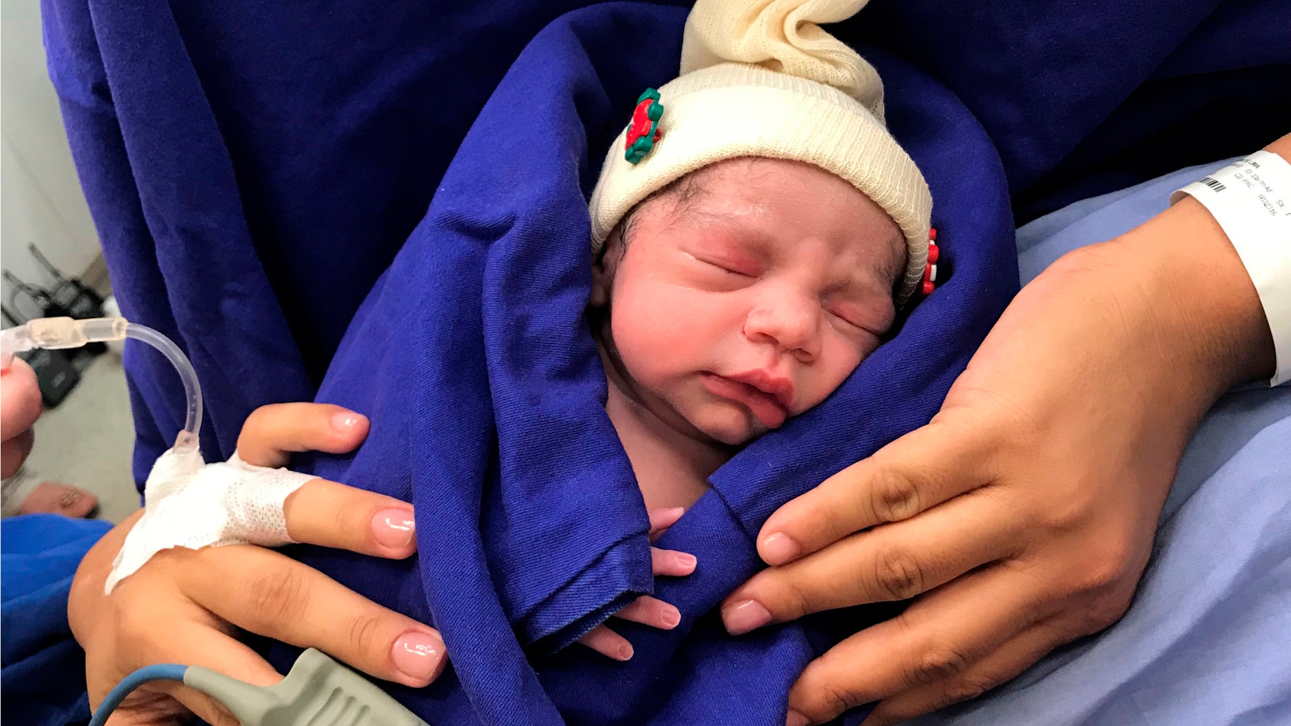 This Dec. 15, 2017 photo provided by transplant surgeon Dr. Wellington Andraus shows the baby girl born to a woman with a uterus transplanted from a deceased donor at the Hospital das Clinicas of the University of Sao Paulo School of Medicine, Sao Paulo, Brazil, on the day of her birth.
