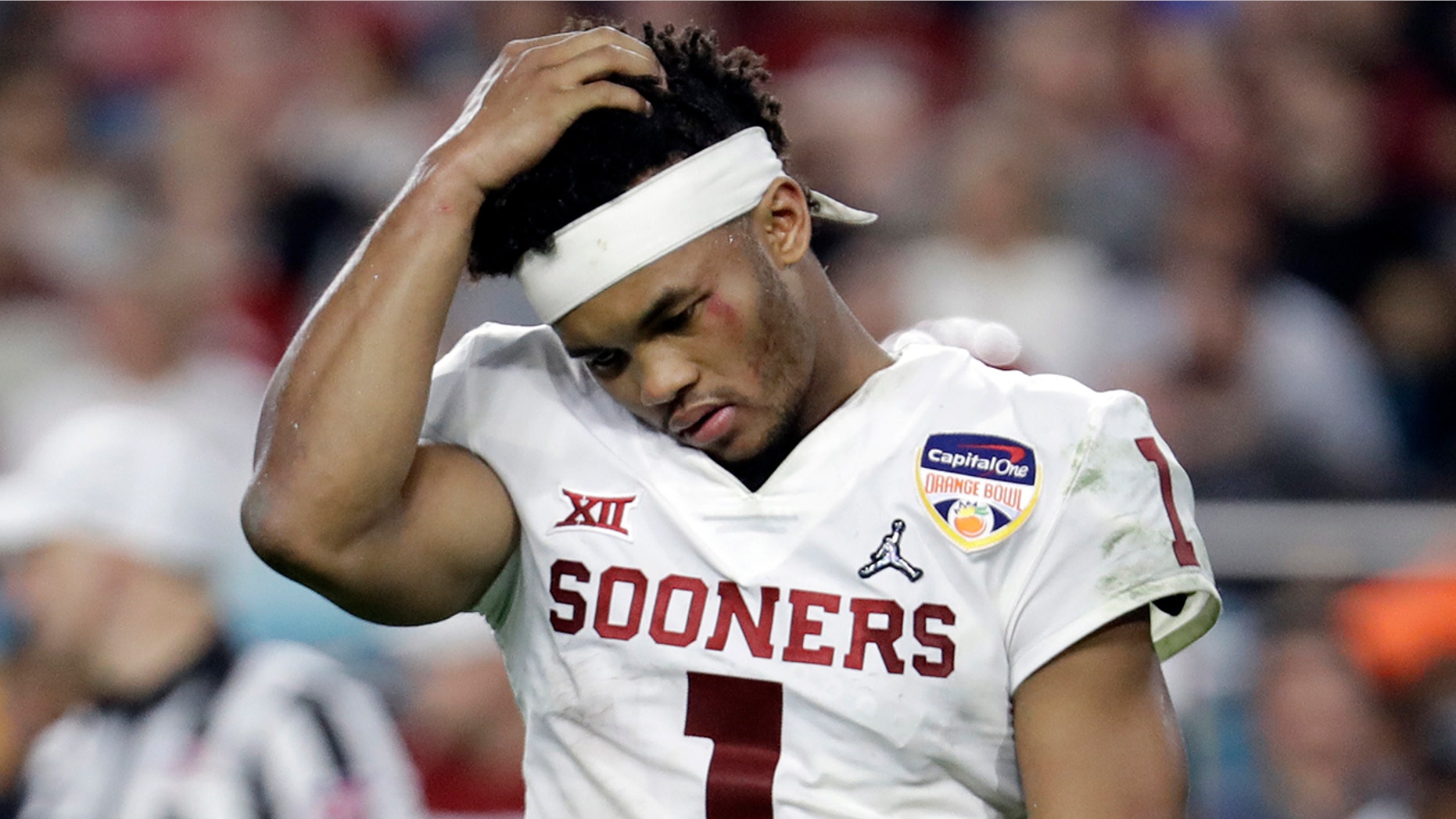 Oklahoma quarterback Kyler Murray (1) walks off the field after his helmet came off on a play, during the second half of the Orange Bowl NCAA college football game against Alabama, Saturday, Dec. 29, 2018, in Miami Gardens, Fla.