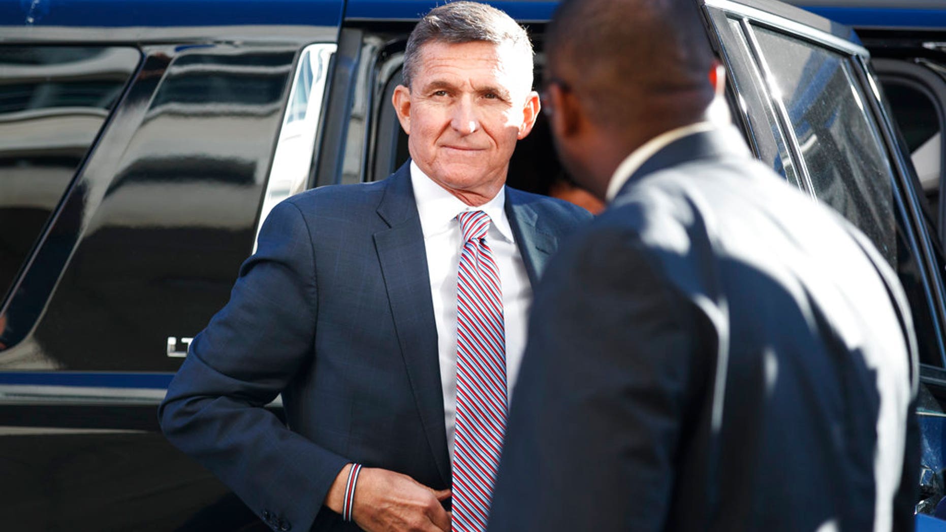 President Donald Trump's former National Security Advisor Michael Flynn arrives at federal court in Washington, Tuesday, Dec. 18, 2018. (AP Photo/Carolyn Kaster)