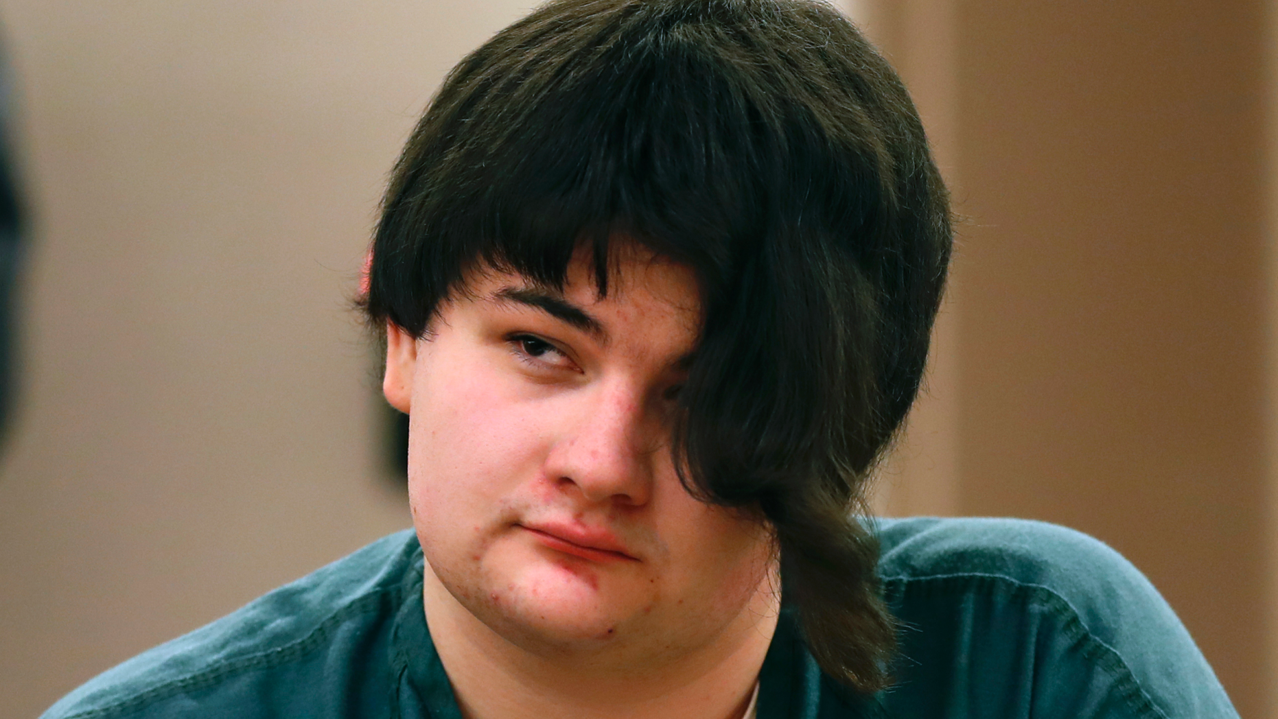 Andrea Balcer listens to testimony during the sentencing hearing for killing her parents, Tuesday, Dec. 4, 2018, at the Capital Judicial Center in Augusta, Maine. (Associated Press)