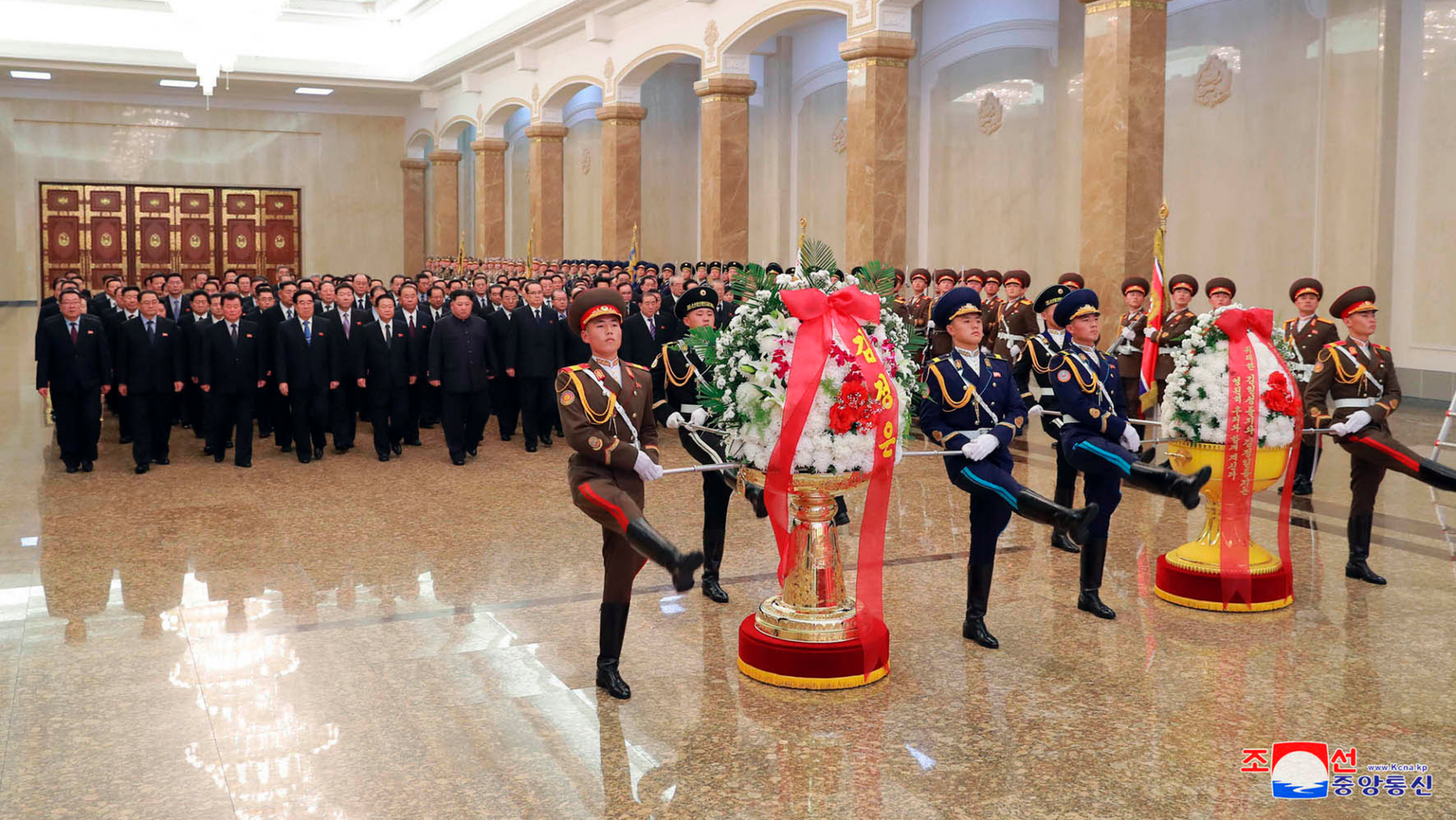 In this photo provided by the North Korean government, North Korean leader Kim Jong Un, sixth from left, visits the Kumsusan Palace of the Sun, where the body of late leader Kim Jong Il is laid, in Pyongyang, North Korea, Monday, Dec. 17, 2018.  North Koreans are marking the seventh anniversary of the death of leader Kim Jong Il with visits to statues and vows of loyalty to his son and successor, Kim Jong Un. Independent journalists were not given access to cover the event depicted in this image distributed by the North Korean government. The content of this image is as provided and cannot be independently verified. Korean language watermark on image as provided by source reads: "KCNA" which is the abbreviation for Korean Central News Agency. (Korean Central News Agency/Korea News Service via AP)