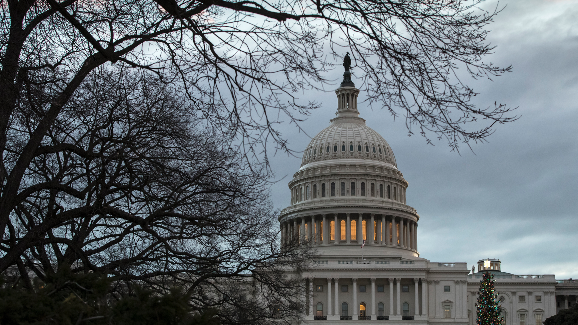 The Capitol is seen on the first morning of a partial government shutdown, as Democratic and Republican lawmakers are at a standoff with President Donald Trump on spending for his border wall, in Washington, Saturday, Dec. 22, 2018. A partial federal shutdown took hold early Saturday after Democrats refused to meet President Donald Trump's demands for $5 billion to start erecting a wall with Mexico. (AP Photo/J. Scott Applewhite)