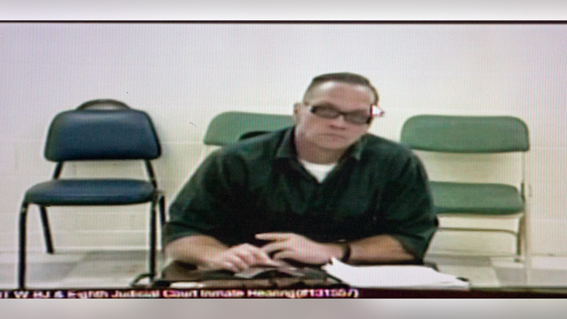 FILE - In this Dec. 5, 2017, file photo, Nevada death row inmate Scott Dozier appears for his court hearing via video at the Regional Justice Center in Las Vegas. Nevada prison officials say death row inmate Dozier has gone to great lengths to try to kill himself while awaiting execution, including attempting to obtain a fatal drop of a deadly drug on a piece of paper sent through prison mail. (Erik Verduzco/Las Vegas Review-Journal via AP)