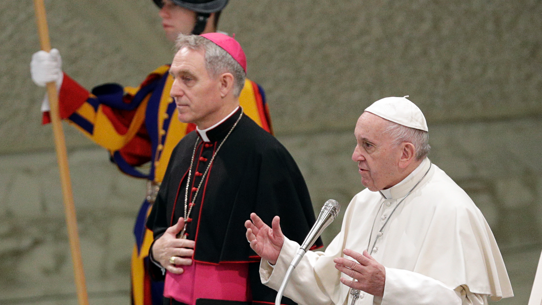 Pope Francis flanked by Monsignor Georg Gaenswein blesses the faithful on the occasion of the weekly general audience, at the Vatican, Wednesday, Dec. 19, 2018. (AP Photo/Gregorio Borgia)