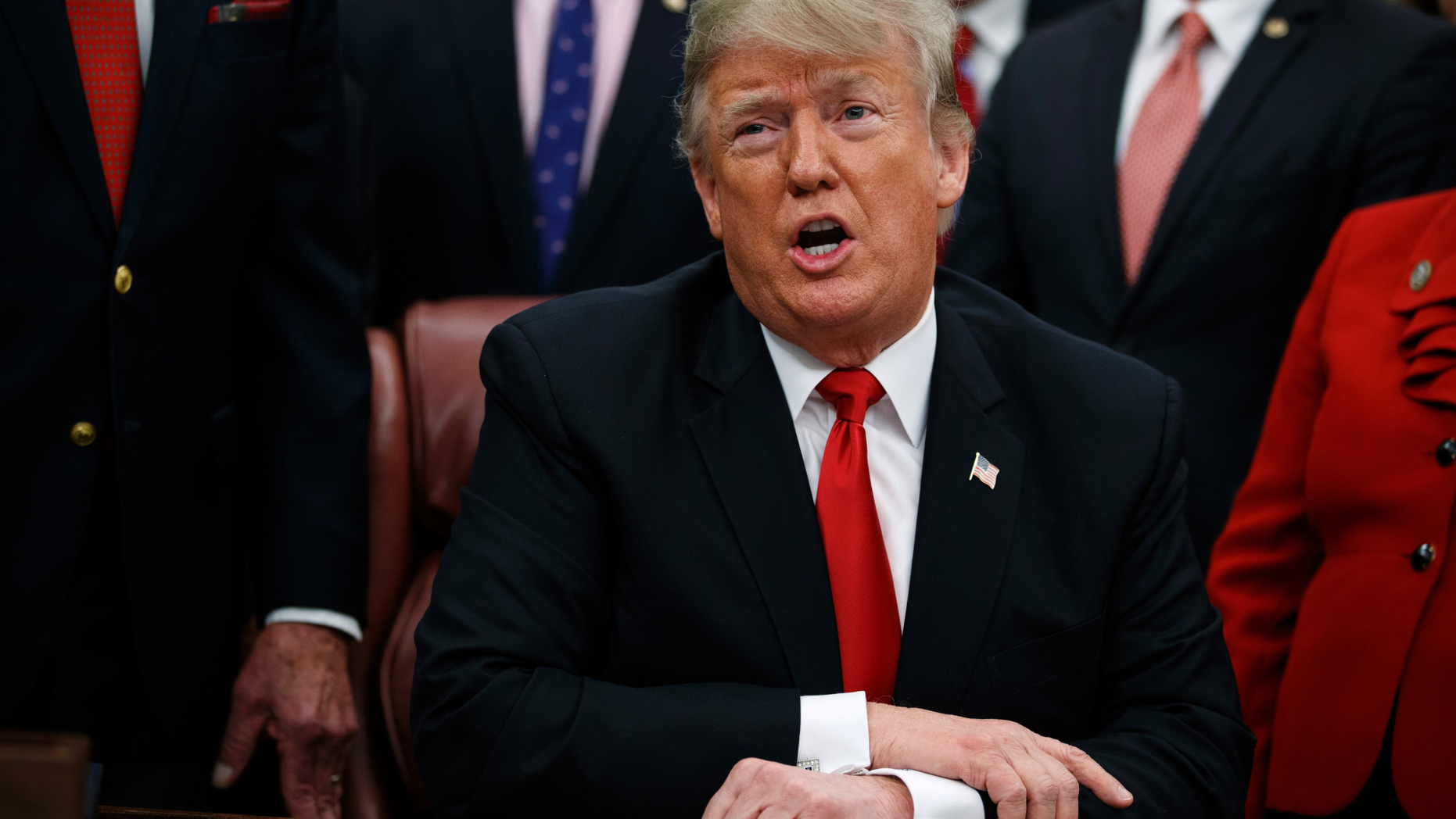 FILE - In this Friday, Dec. 21, 2018 file photo, President Donald Trump makes a statement on the possible government shutdown before signing criminal just reform legislation in the Oval Office of the White House, in Washington. Nancy Pelosi and Trump both think they have public sentiment on their side in the battle over a border wall. That theory will be put the test this week when the new House Democratic majority led by Pelosi gavels into session with legislation to end the government shutdown. (AP Photo/Evan Vucci, File)