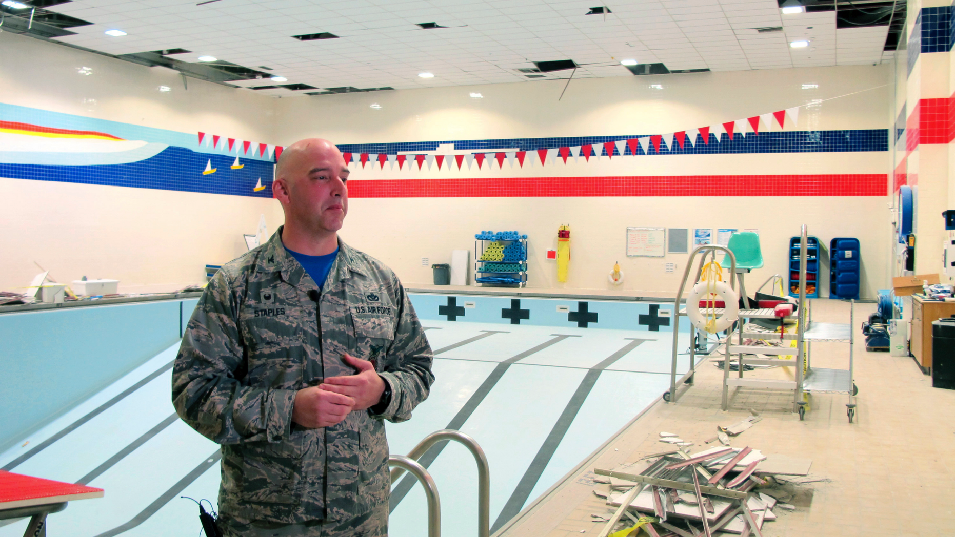 Air Force Col. Michael Staples shows damage from the powerful Nov. 30 earthquake, at Joint Base Elmendorf-Richardson Friday, Dec. 7, 2018, in Anchorage, Alaska. The magnitude 7.0 earthquake caused multiple problems around the base, including damage to steel frameworks, ceilings, and sprinkler and heating systems, but no catastrophic damage. (AP Photo/Rachel D'Oro)