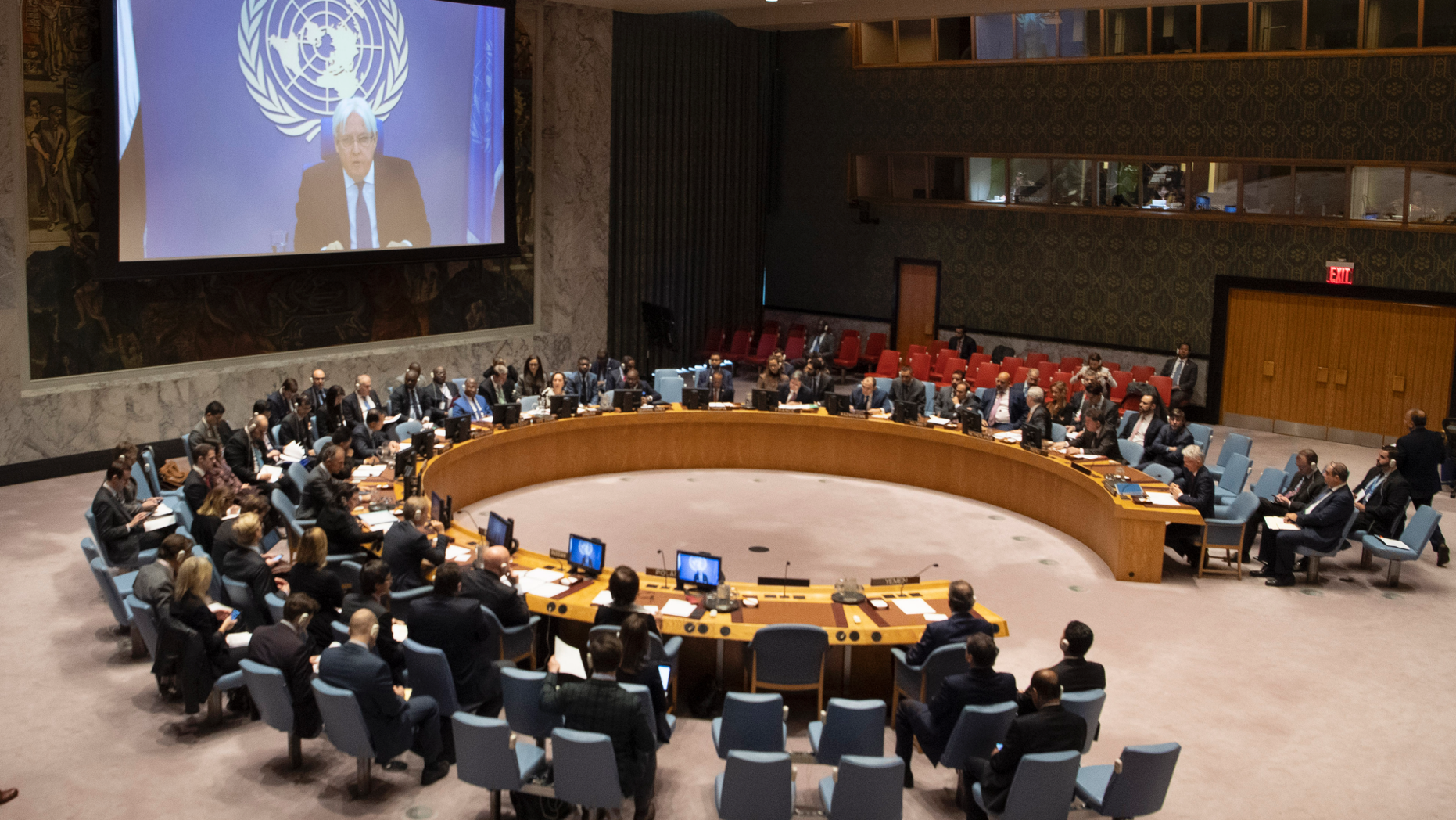 Martin Griffiths, top, the United Nations envoy for Yemen, gives a video briefing to the Security Council at U.N. headquarters Friday, Dec. 14, 2018. Griffiths told the council that a speedy presence in the field is "an essential part of the confidence" needed to accompany implementation of Thursday's agreement between Yemen's government and Houthi Shiite rebels. (Eskinder Debebe/United Nations via AP)