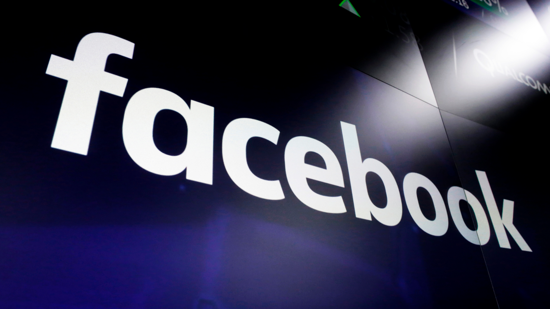 FILE - In this March 29, 2018, file photo, the logo for Facebook appears on screens at the Nasdaq MarketSite in New York's Times Square. (AP Photo/Richard Drew, File)