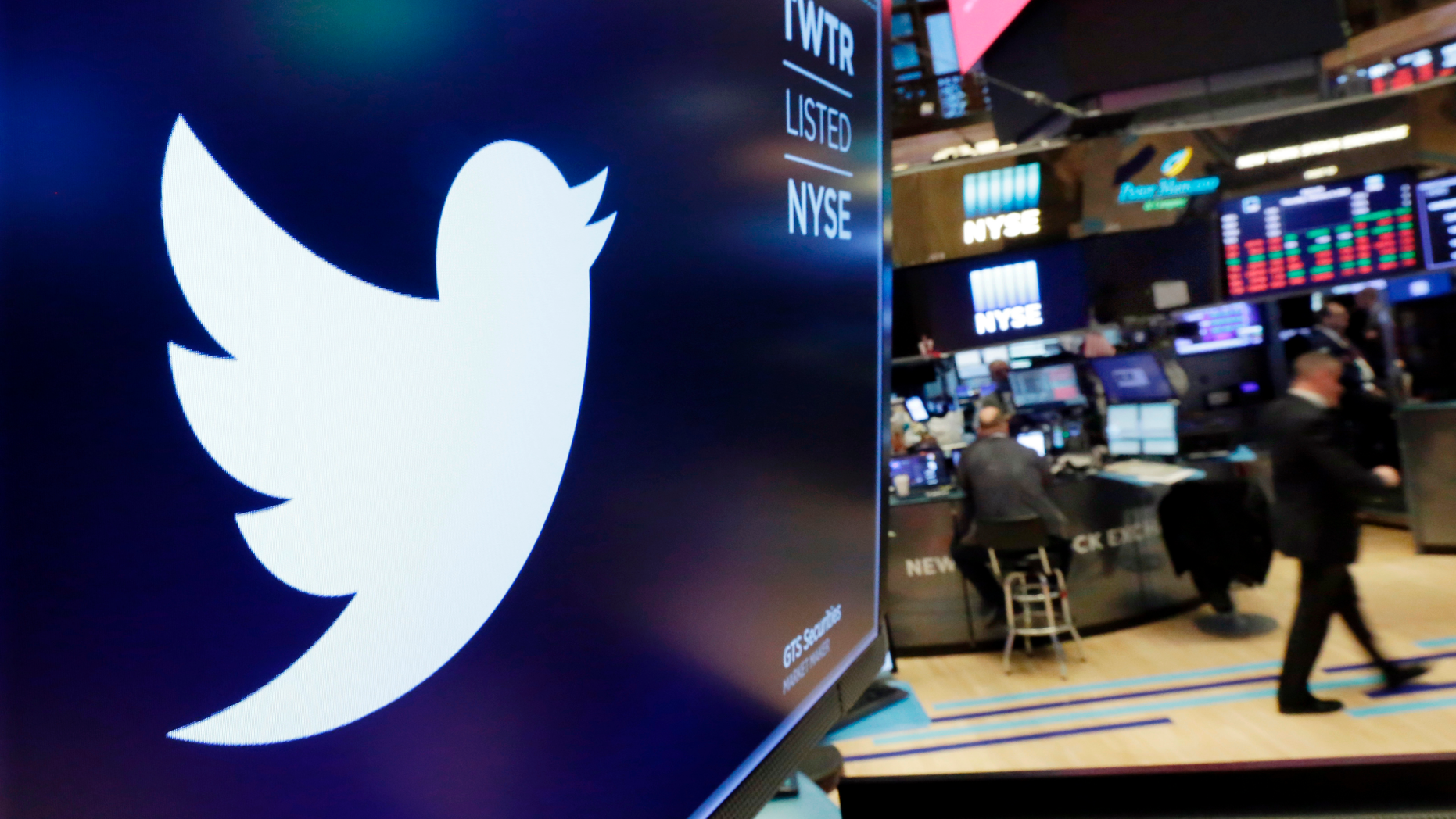 FILE - In this Feb. 8, 2018, file photo, the logo for Twitter is displayed above a trading post on the floor of the New York Stock Exchange (AP Photo/Richard Drew, File)
