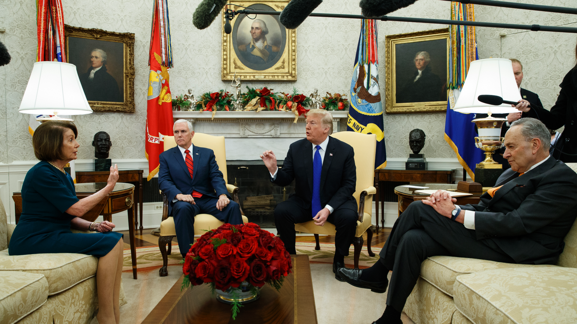 House Minority Leader Rep. Nancy Pelosi, D-Calif., Vice President Mike Pence, President Donald Trump, and Senate Minority Leader Chuck Schumer, D-N.Y., argue during a meeting in the Oval Office of the White House, Tuesday, Dec. 11, 2018, in Washington. (AP Photo/Evan Vucci)