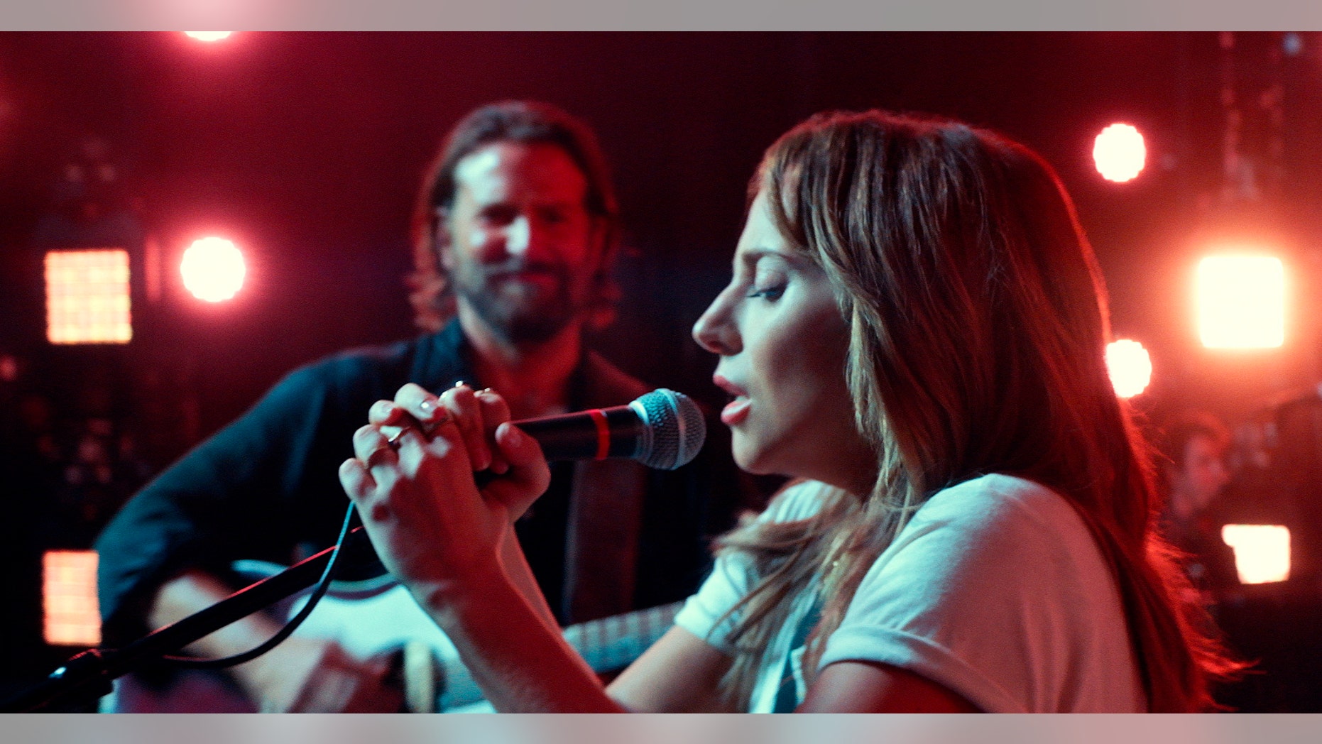 Bradley Cooper, left, and Lady Gaga in a scene from the latest reboot of the film, "A Star is Born."