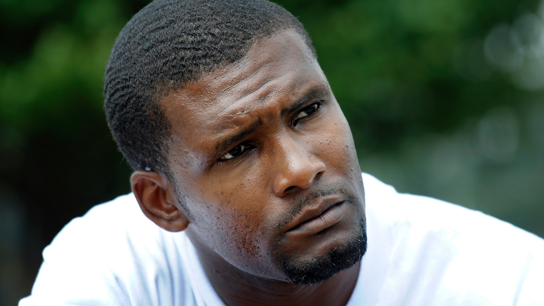 FILE- In this Friday, Aug. 20, 2010, file photo, Daniel Green, who is serving a life sentence for the July 1993 death of former NBA basketball star Michael Jordan's father James Jordan, listens to questions during an interview at the Harnett County Correctional Institute in Lillington, N.C. A North Carolina judge is scheduled to hear arguments Wednesday, Dec. 5, in the case of Green. The judge will decide whether the arguments warrant an evidentiary hearing that could lead to a new trial for Green. (AP Photo/Sara D. Davis, File)