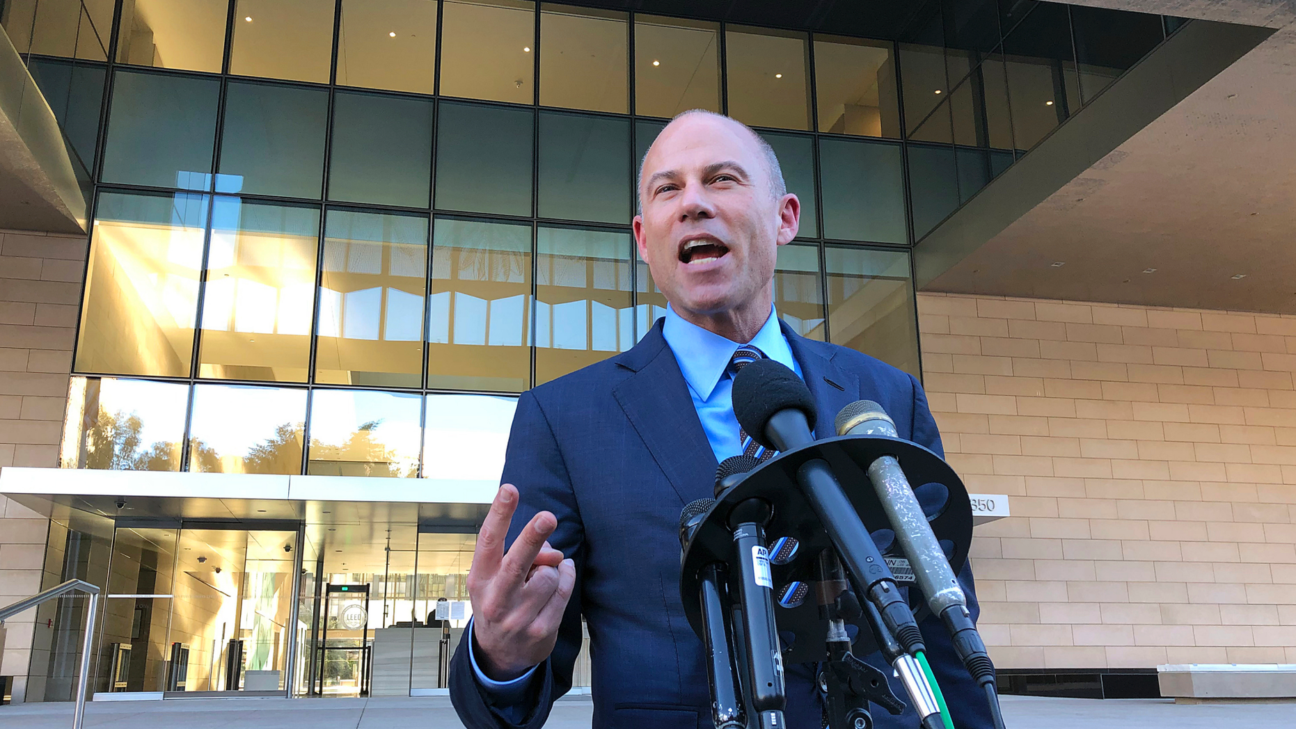 Michael Avenatti, lawyer for porn actress Stormy Daniels, speaks to reporters outside federal court in Los Angeles Monday, Dec. 3, 2018. He said that demands by lawyers for President Donald Trump for legal fees amounting to nearly $800,000 for filing a failed defamation lawsuit against him were "absurd and outrageous." Trump attorney Charles Harder told a federal judge in Los Angeles Monday that his firm put in more than 500 hours on the case. Daniels alleges she had an affair with Trump in 2006. She sued him after he dismissed her claims of being threatened to keep quiet about the tryst as a "total con job." (AP Photo/Brian Melley)
