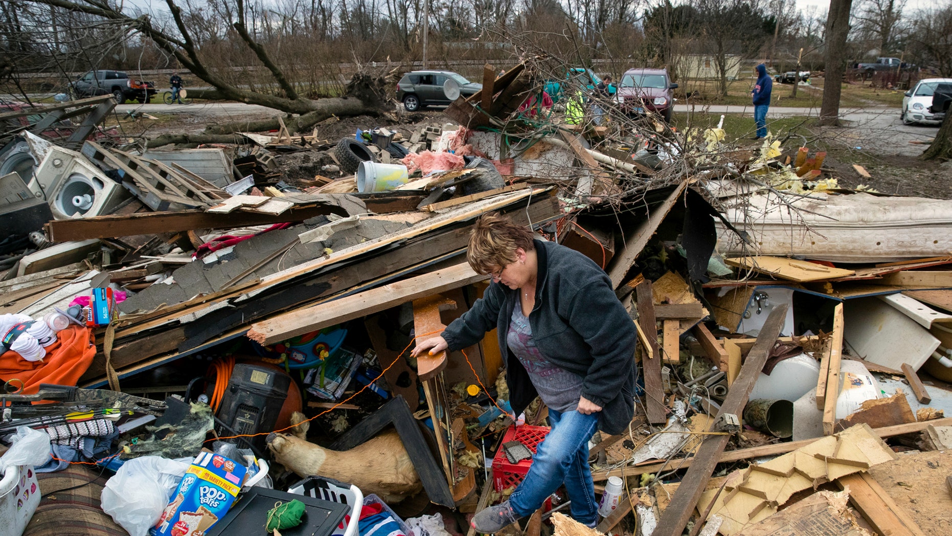 Joyce Morrissey sorts by a waste of her nephew Stephen Tirpak's residence in Taylorville, Ill., Sunday, Dec. 2, 2018. The National Weather Service says mixed tornadoes overwhelmed down in executive Illinois, deleterious dozens of structures and injuring mixed people. (Ted Schurter/The State Journal-Register around AP)