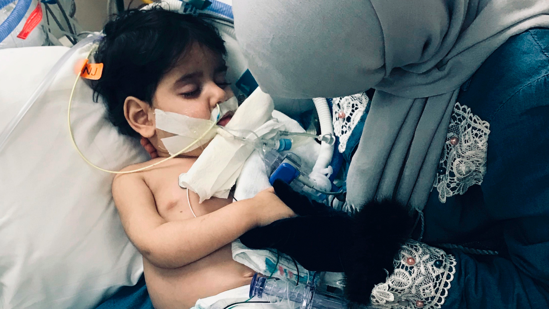 In this December 2018 photo released by the Council on American Islamic Relations, Sacramento Valley, Shaima Swileh, of Yemen, holds her dying 2-year old son Abdullah Hassan at UCSF Benioff Children's Hospital in Oakland, Calif. USA. The Council on American-Islamic Relations announced Friday, Dec. 28, 2018, that Abdullah died at the Oakland hospital, where his father Ali Hassan brought him in the fall to get treatment for a genetic brain disorder. Swileh, who is not an American citizen, sued the Trump administration to let her into the country to be with the ailing boy. (Council on American Islamic Relations, Sacramento Valley via AP)