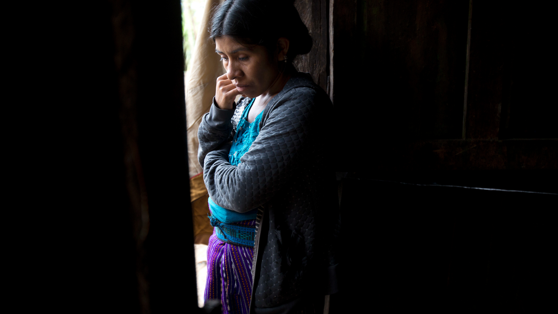 Catarina Alonzo Perez, mother of the second Guatemalan child this month to die while in U.S. custody, stands in her kitchen in Yalambojoch, Guatemala, Saturday, Dec. 29, 2018. Felipe was healthy when they left, according to the family. The last time he spoke with his mother was a day before they were taken into detention by border agents. Felipe told his mother that he was fine. (AP Photo/Moises Castillo)