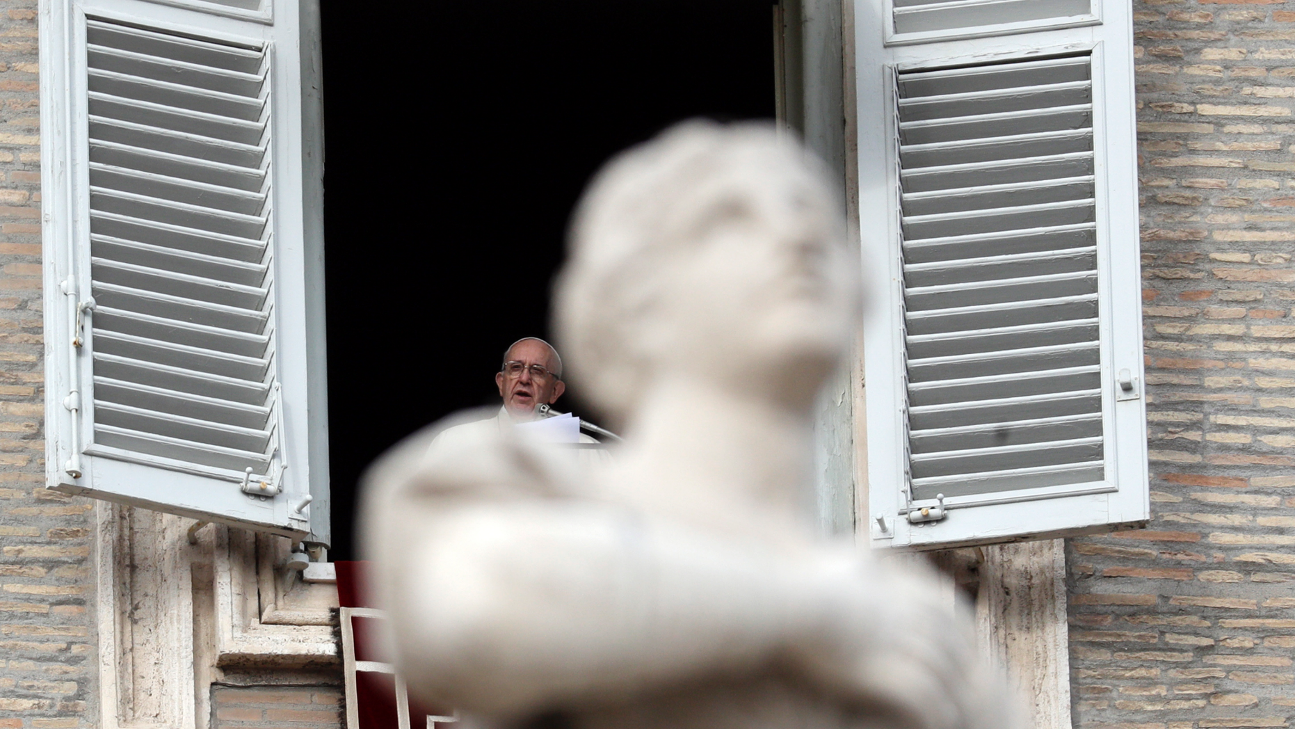Pope Francis delivers his message during the Angelus noon prayer in St. Peter's Square, at the Vatican, Sunday, Dec. 16, 2018. (AP Photo/Gregorio Borgia)