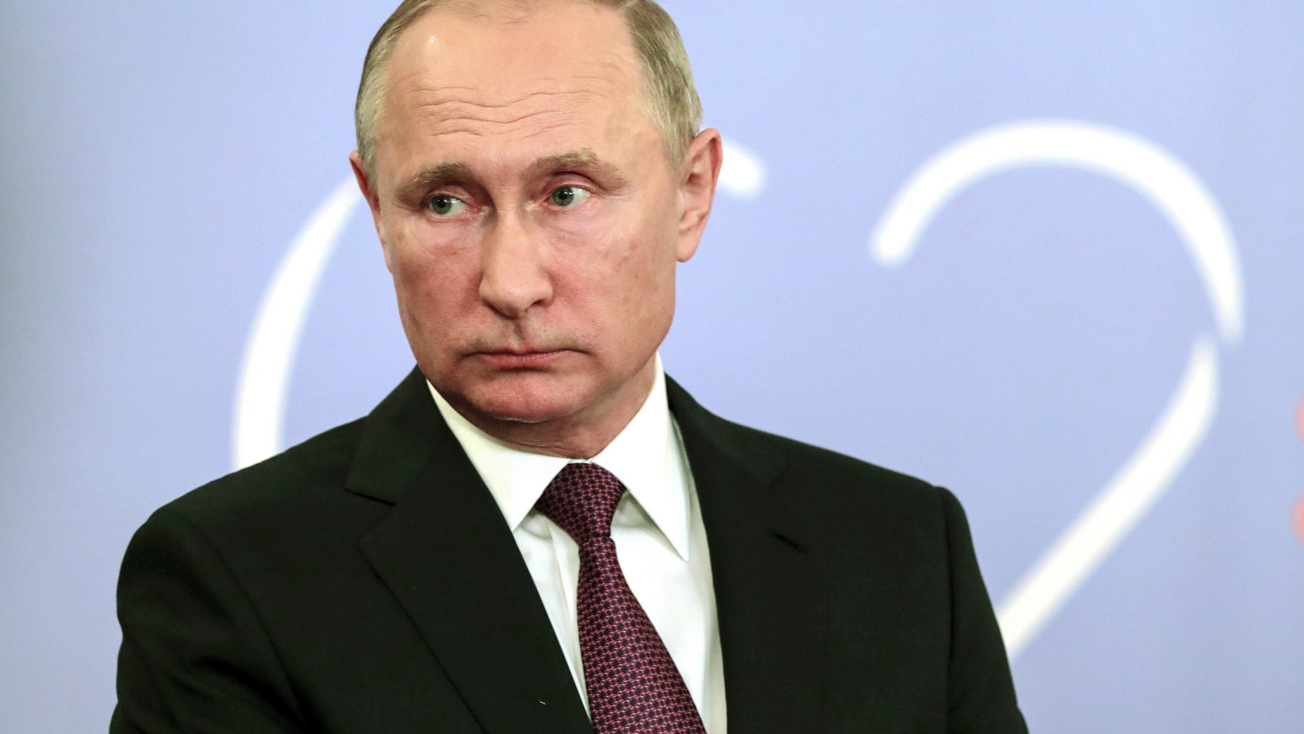 Russian President Vladimir Putin speaks to the media after the G20 summit in Buenos Aires, Argentina, Saturday, Dec. 1, 2018. Putin and Trump "said hi to each other," according to the Russian leader's spokesman, but didn't shake hands or otherwise interchange, even during the "family photo" when leaders rub elbows as they get into place and usually exchange small talk. (Mikhail Klimentyev, Sputnik, Kremlin Pool Photo via AP)