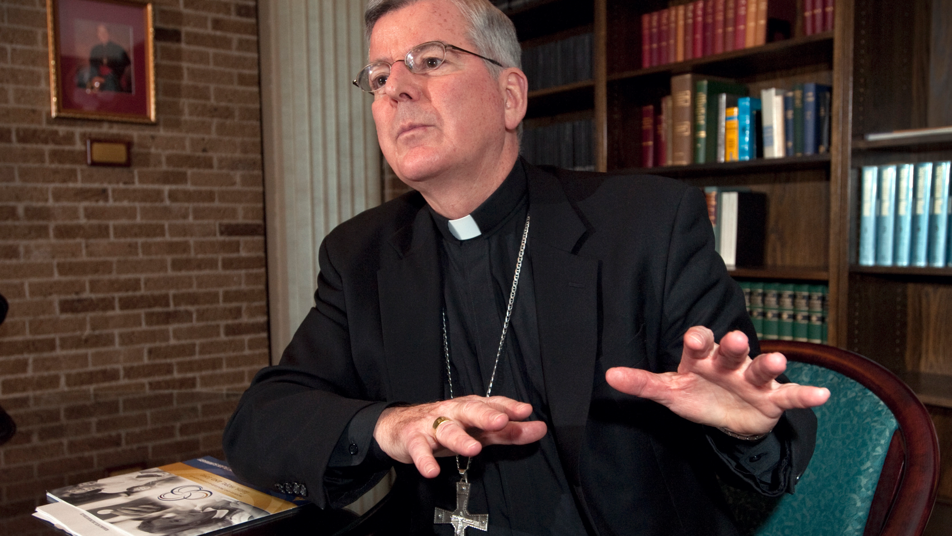 FILE - In this photograph taken on Monday, Oct. 18, 2010, Archbishop John C. Nienstedt talks about the Archdiocese of St. Paul and Minneapolis consolidation plan, which includes closing 21 churches, at his office in St. Paul, Minn. His successor, St. Paul and Minneapolis Archbishop Bernard Hebda wrote a remarkable letter to his flock Friday, Dec. 14, 2018, in which he revealed he sent the Vatican in 2016 a new allegation of improprieties with minors against retired Archbishop John Nienstedt. (AP Photo/Craig Lassig)