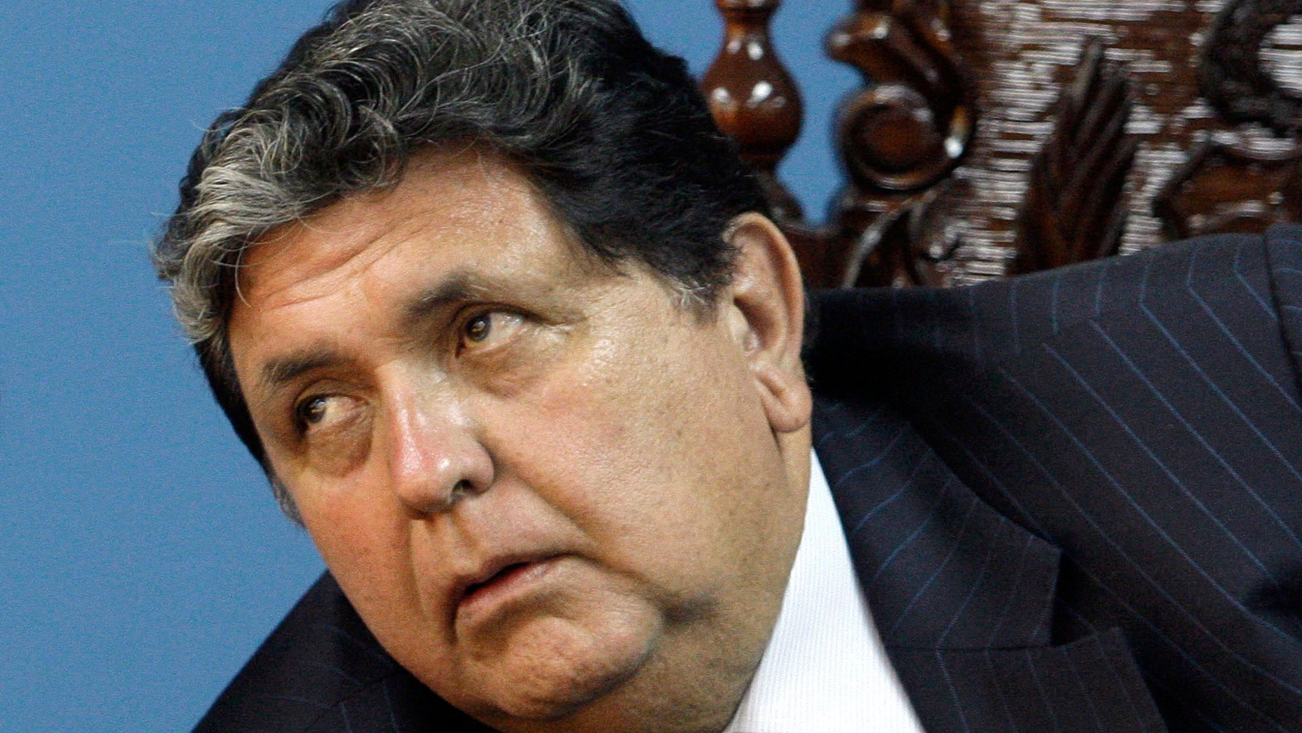 FILE - In this Oct. 19, 2010 file photo, Peru's then President Alan Garcia, attends a meeting in the Port of Ilo, southern Peru. Garcia said Monday, Dec. 3, 2018, he would cooperate with prosecutors investigating him for corruption after Uruguay turned down his asylum request and forced him to leave the residence of its ambassador to the Andean nation. (AP Photo/Karel Navarro, File)