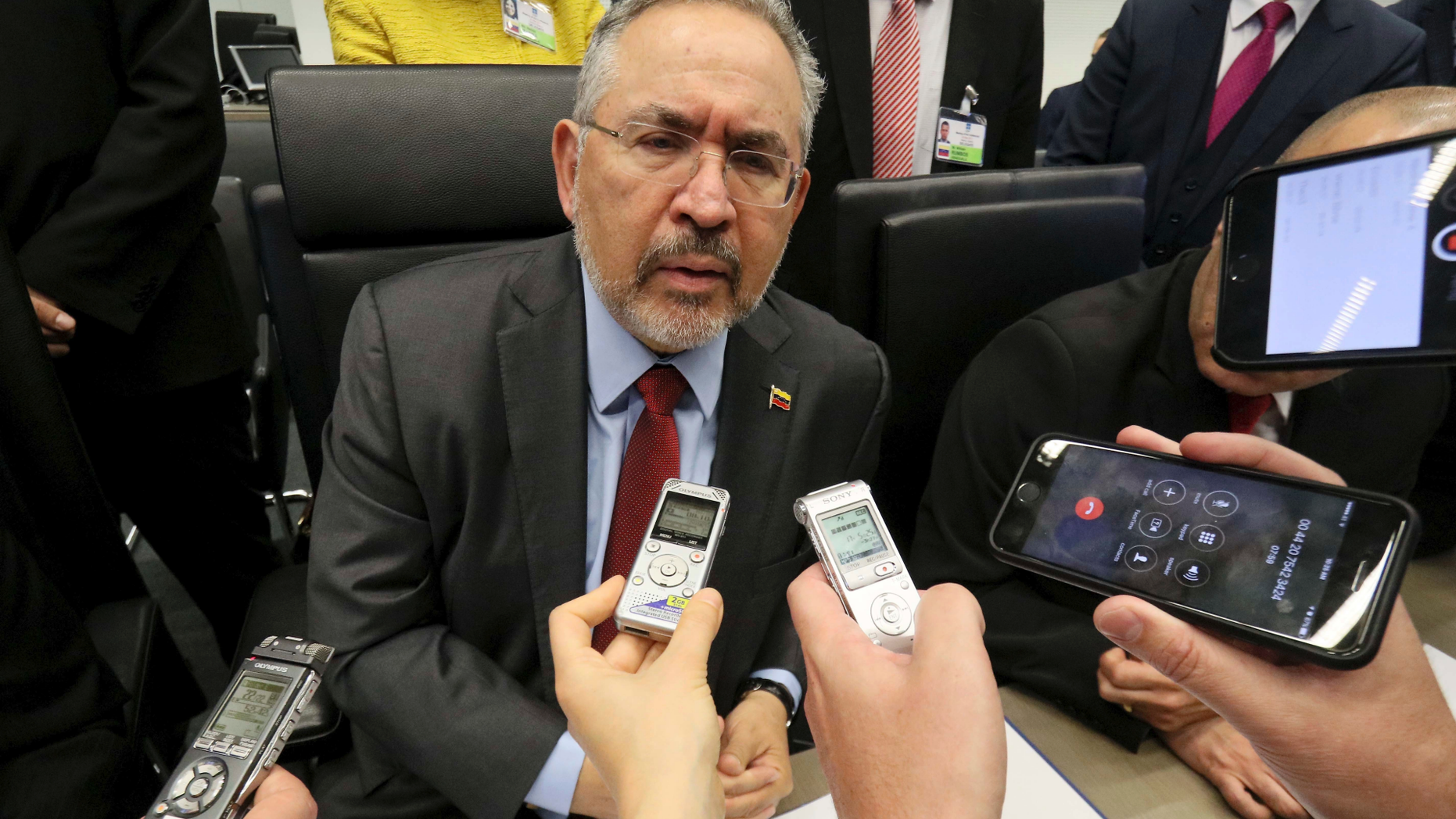FILE - In this May 25, 2017 file photo, Nelson P. Martinez, the People's Minister of Petroleum from Venezuela, speaks to journalists prior to a an OPEC meeting in Vienna, Austria. The jailed, ex-head of PDVSA died on Wednesday, Dec. 12, 2018 in state custody, according to Rafael Ramirez who was Martinez’s boss before being pushed out himself as head of PDVSA. Ramirez said Martinez had been receiving medical treatment for kidney problems at a military hospital, following his 2017 arrest in an anti-corruption purge at PDVSA. (AP Photo/Ronald Zak, File)